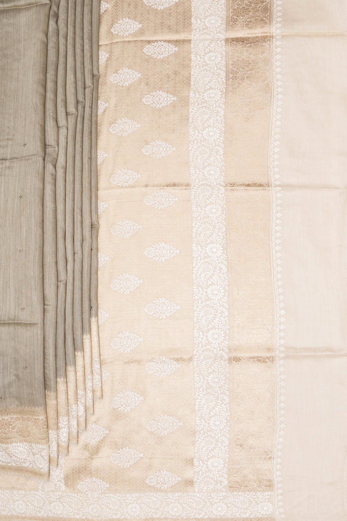 Pleats and pallu of Pure Silk Dark Beige Tussar Saree with Embroidery on the body and Embroidery Border. 