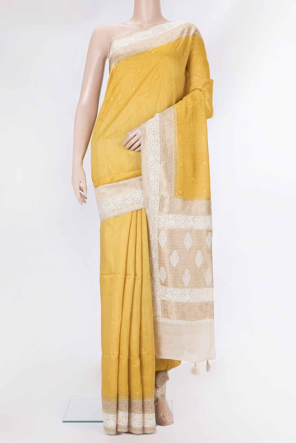 Pure Silk Mustard Dual Tone Tussar Saree with Embroidery on the body and Embroidery Border.  displayed on a mannequin