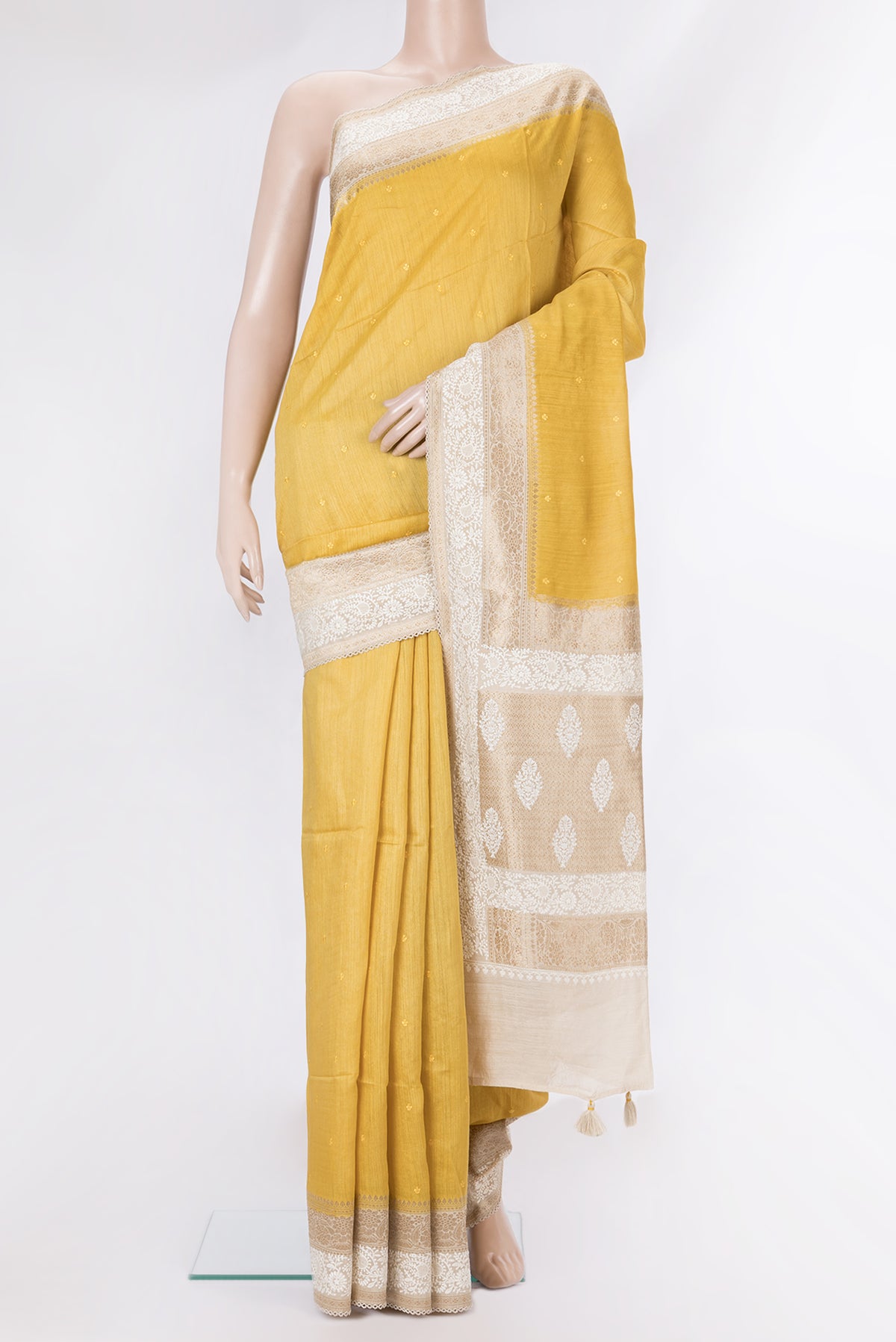 Pure Silk Mustard Dual Tone Tussar Saree with Embroidery on the body and Embroidery Border.  displayed on a mannequin