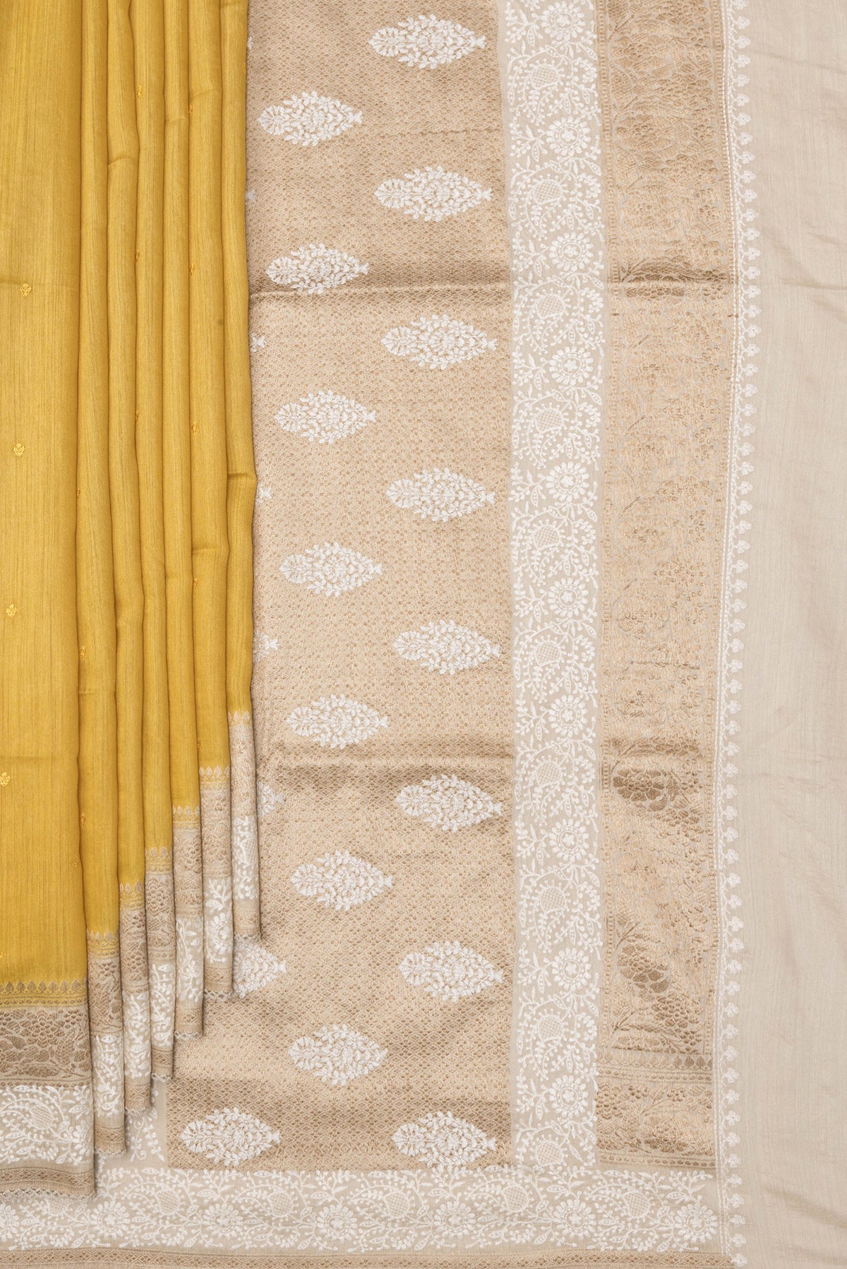 Pleats and pallu of Pure Silk Mustard Dual Tone Tussar Saree with Embroidery on the body and Embroidery Border. 