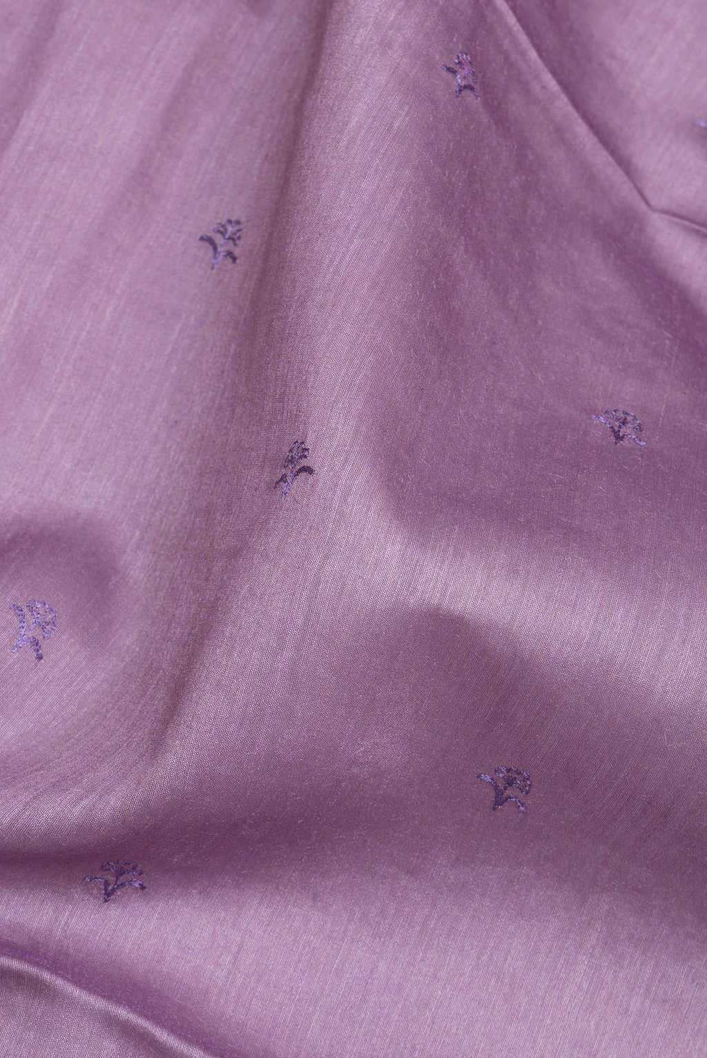 Close up of Pure Silk Lavender Dual Tone Tussar Saree with Embroidery on the body and Embroidery Border.  displaying folds
