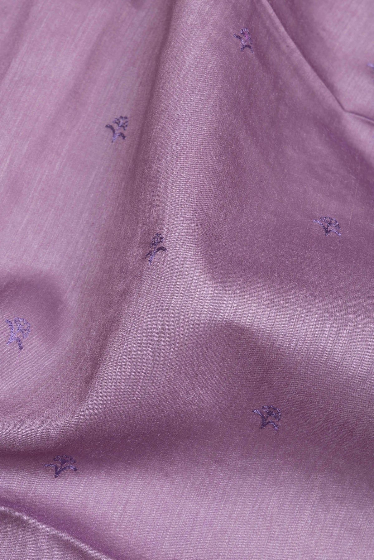 Close up of Pure Silk Lavender Dual Tone Tussar Saree with Embroidery on the body and Embroidery Border.  displaying folds