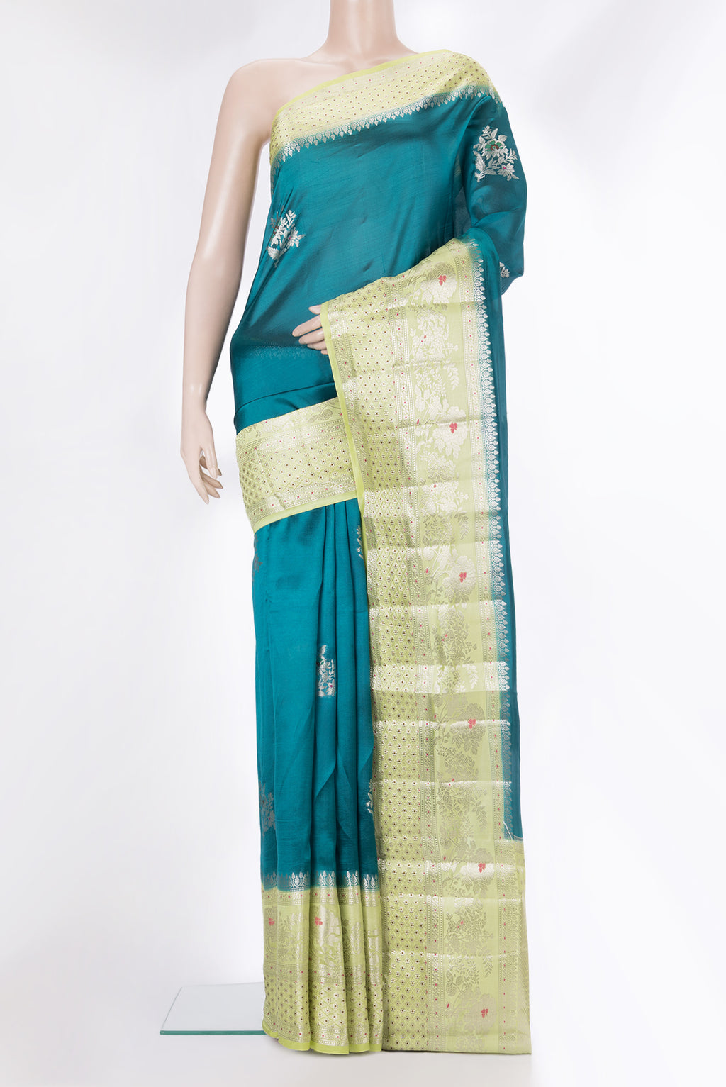 Pure Silk Peacock Blue Dual Tone Tussar Saree with Zari Butta on the body and Fancy Border.  displayed on a mannequin