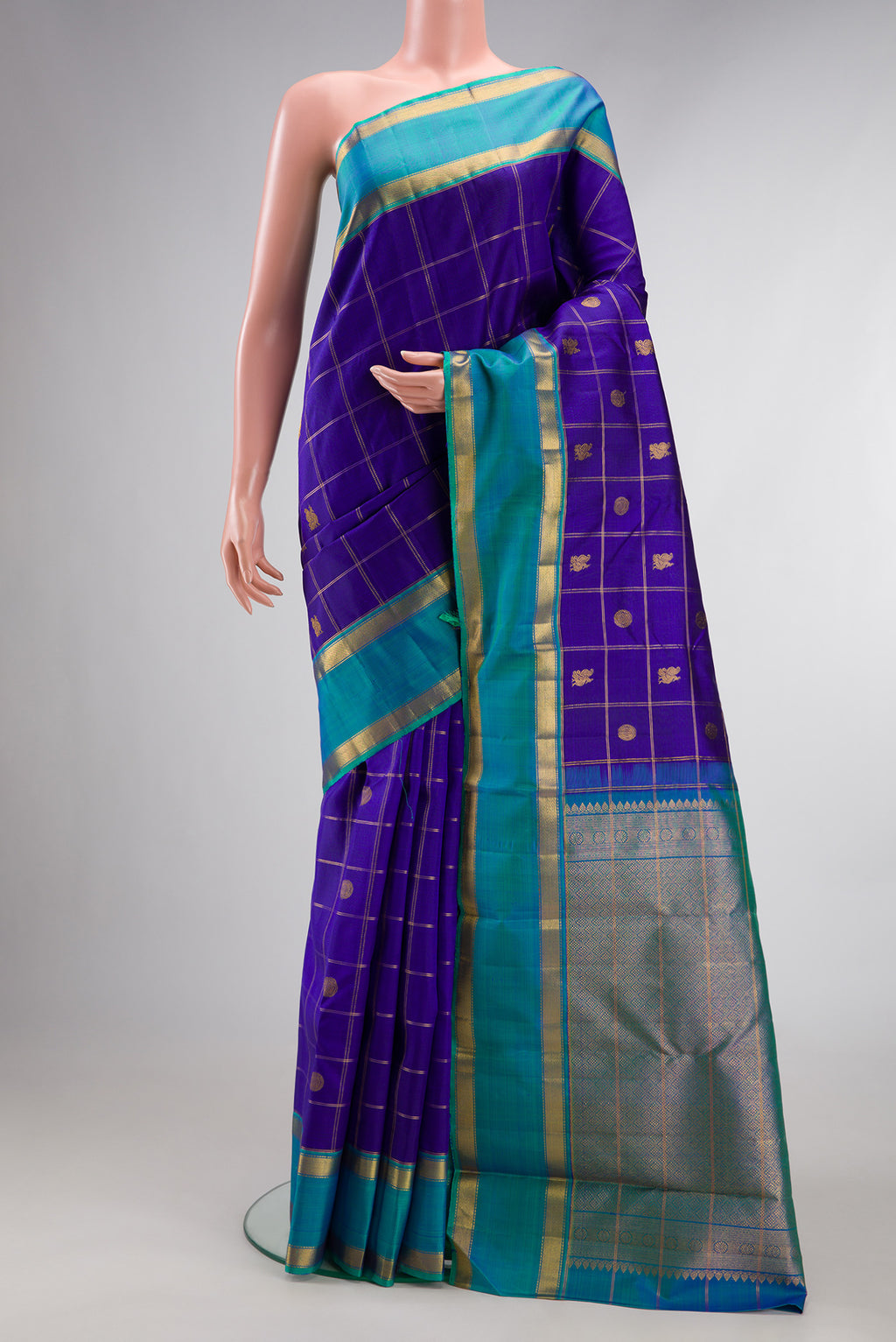 Pure Silk Dark Blue Kanjivaram Saree with Checked design on the body and Zari Border.  displayed on a mannequin