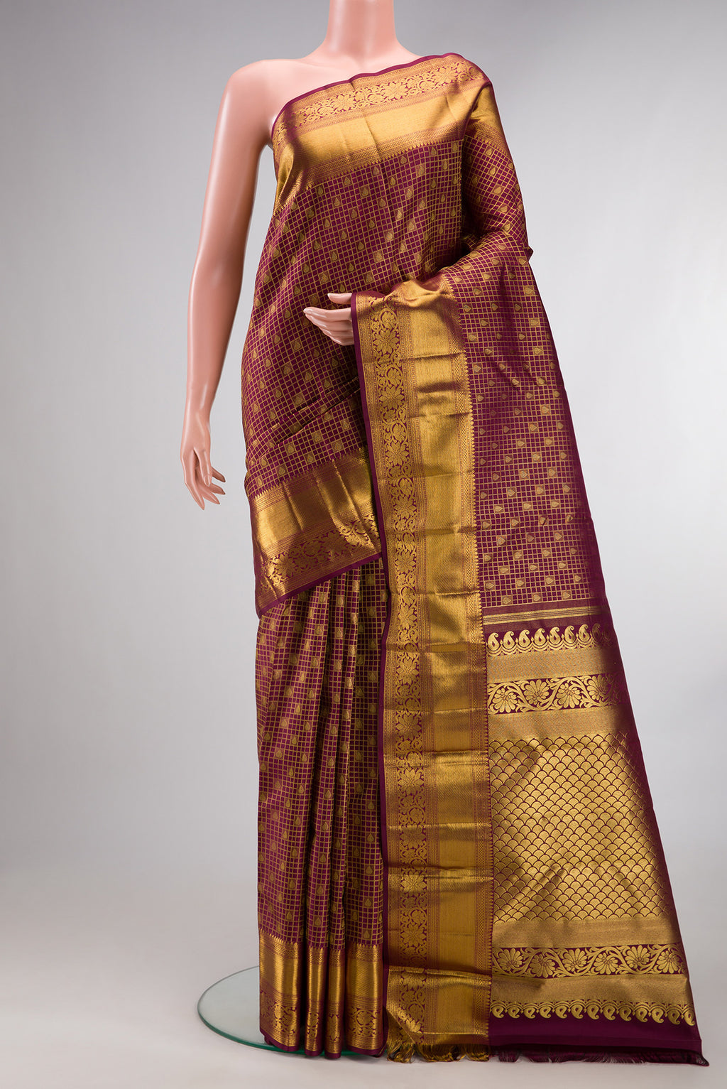 Pure Silk Maroon Dual Tone Kanchipuram Saree with Zari Brocade on the body and Zari Border.  displayed on a mannequin