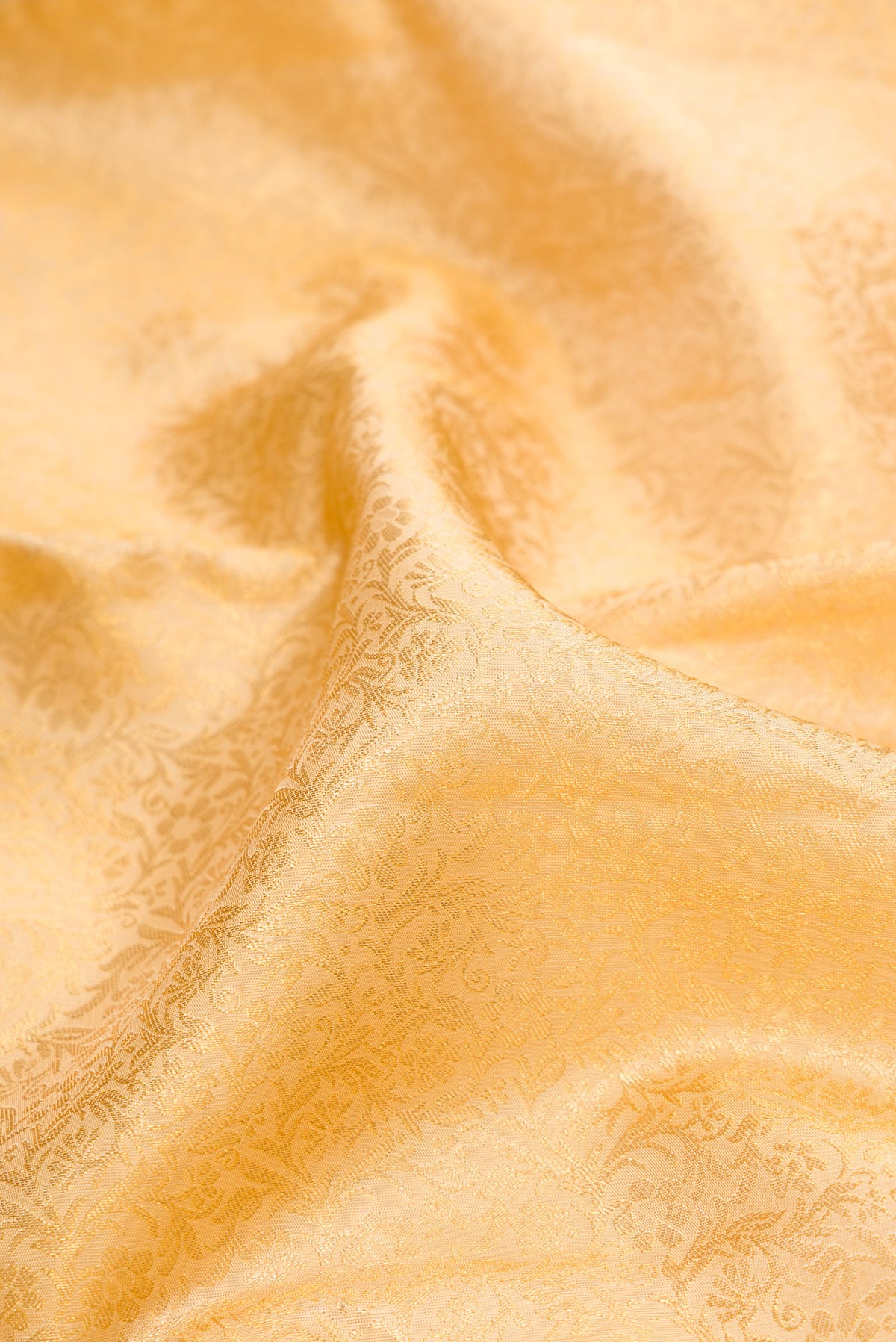 Close up of Pure Silk Sandal Kanchipuram Saree with Zari Brocade on the body and Zari Border.  displaying folds