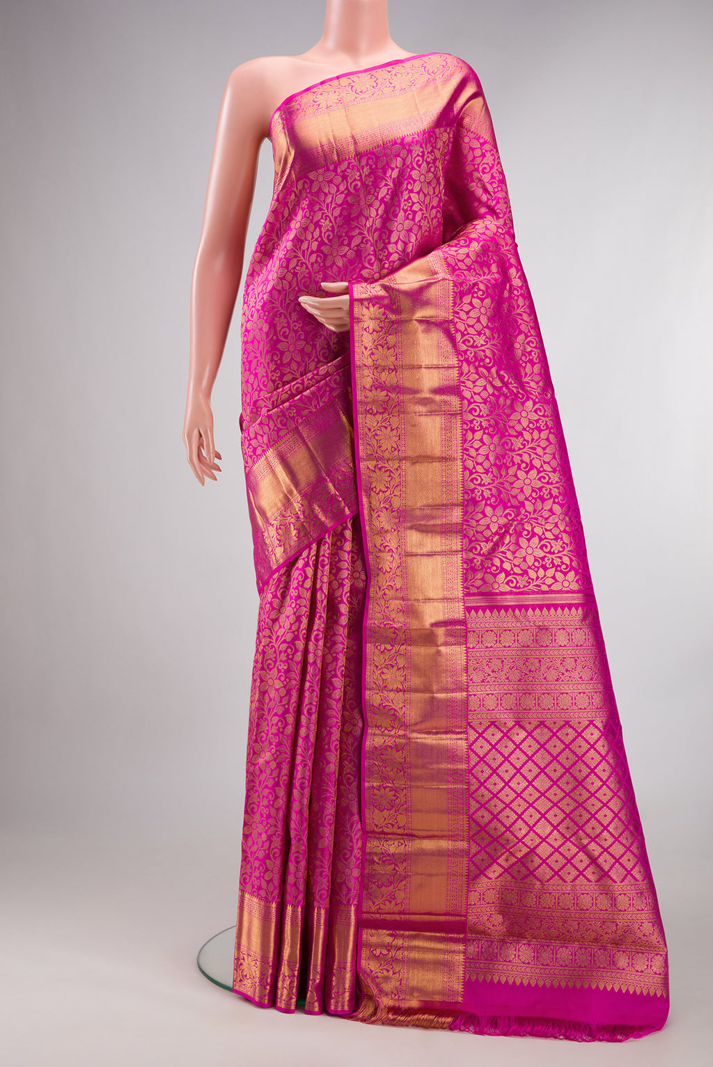 Pure Silk Pink Kanchipuram Saree with Zari Brocade on the body and Zari Border.  displayed on a mannequin