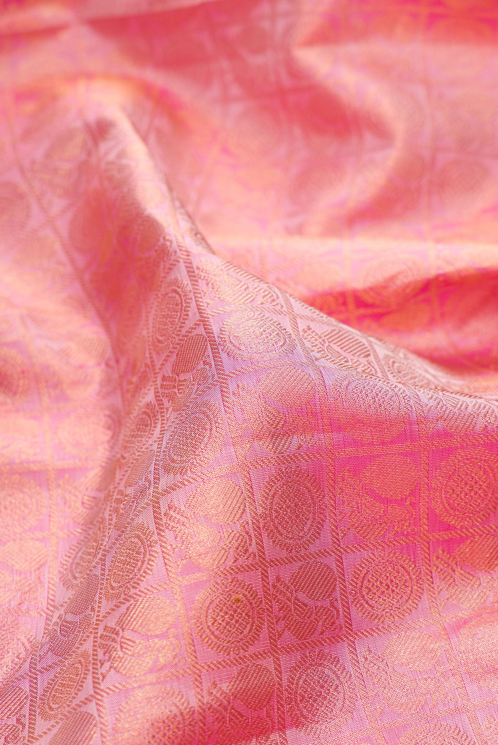 Close up of Pure Silk Pink Dual Tone Kanchipuram Saree with Zari Brocade on the body and Zari Border.  displaying folds
