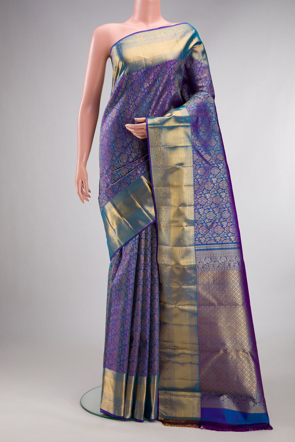 Pure Silk Royal Blue Dual Tone Kanchipuram Saree with Zari Brocade on the body and Zari Border.  displayed on a mannequin
