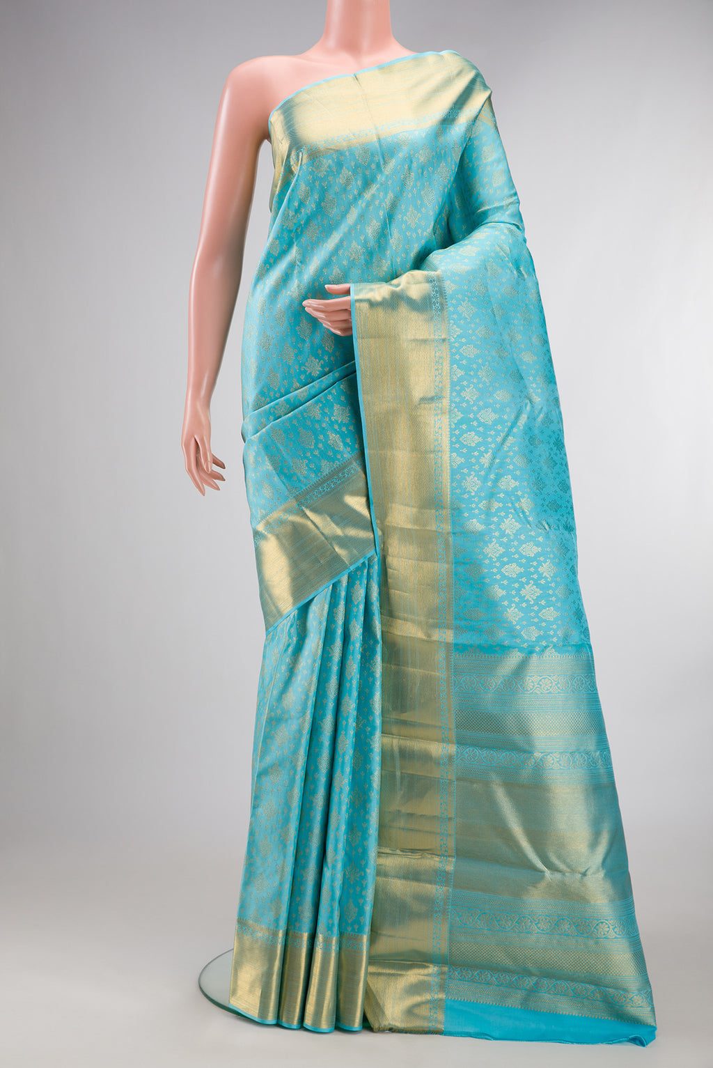 Pure Silk Sky Blue Dual Tone Kanchipuram Saree with Zari Brocade on the body and Zari Border.  displayed on a mannequin