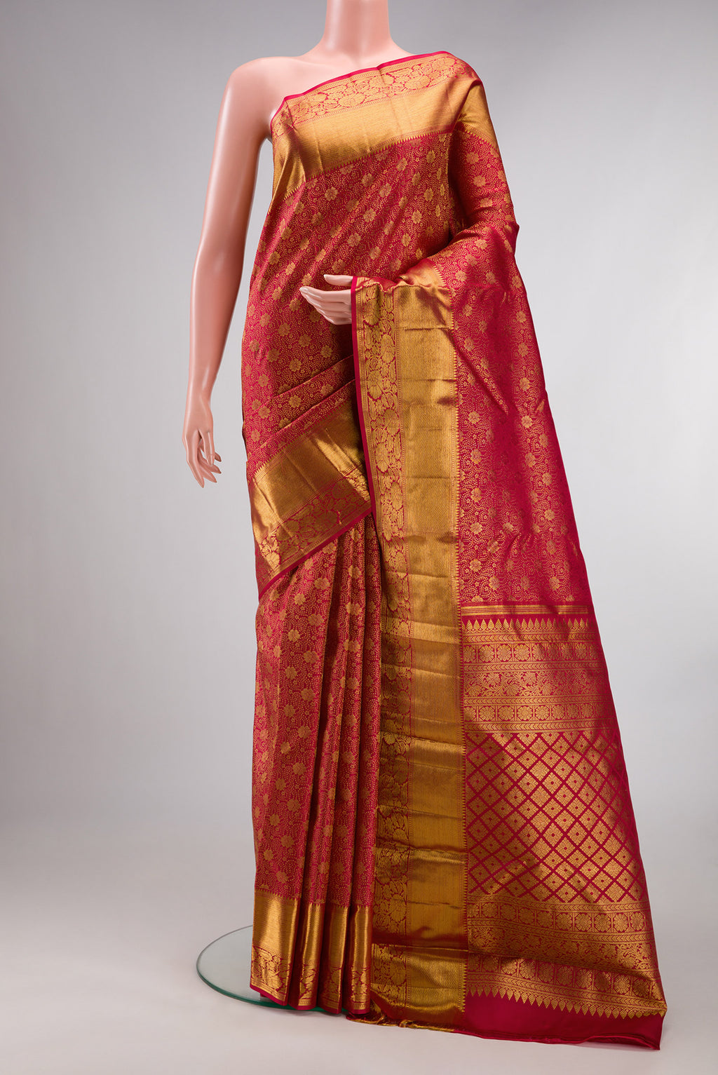 Pure Silk Red Kanchipuram Saree with Zari Brocade on the body and Zari Border.  displayed on a mannequin