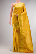 Pure Silk Mustard Kanchipuram Saree with Zari Brocade on the body and Zari Border.  displayed on a mannequin