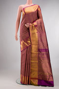 Pure Silk Magenta Kanchipuram Saree with Zari Brocade on the body and Zari Border.  displayed on a mannequin