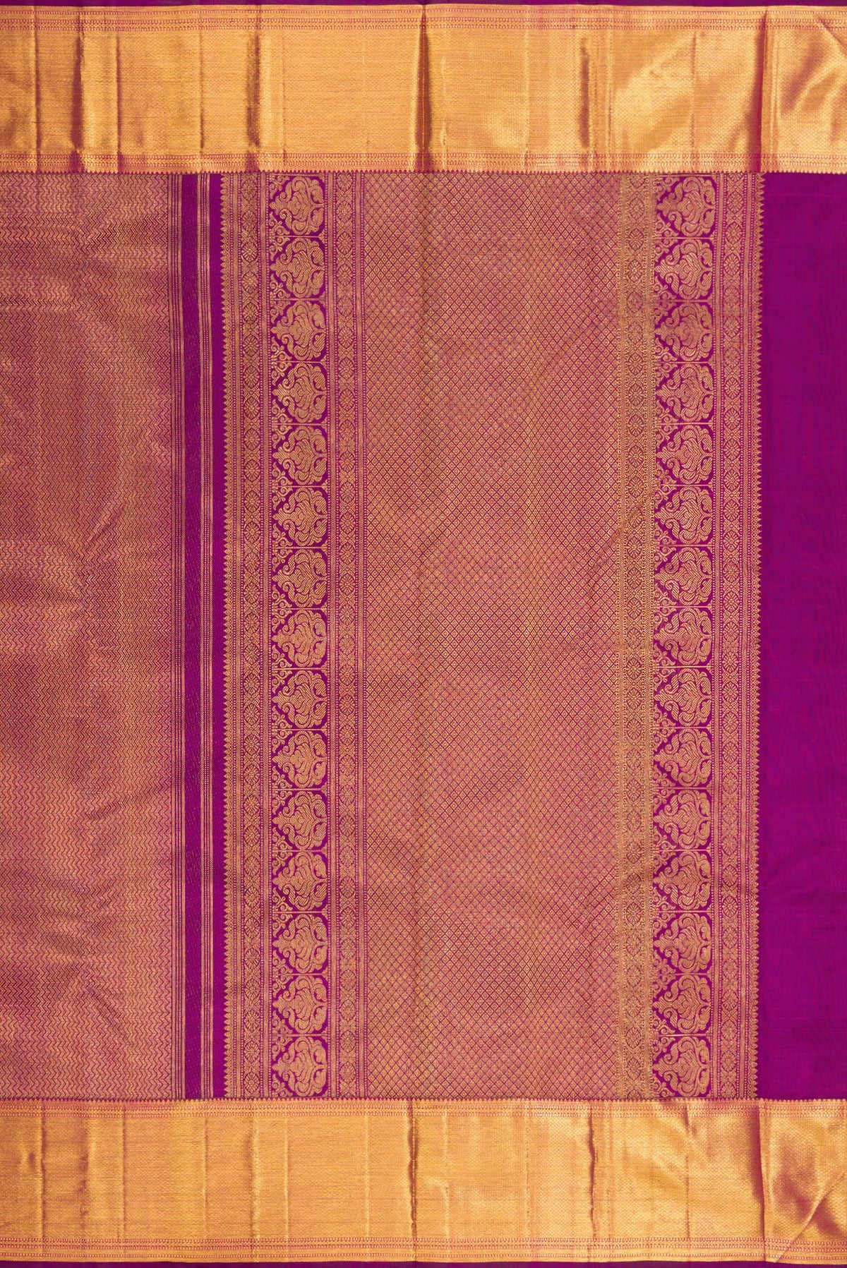 Close up image of the pallu of Pure Silk Magenta Kanchipuram Saree with Zari Brocade on the body and Zari Border. 