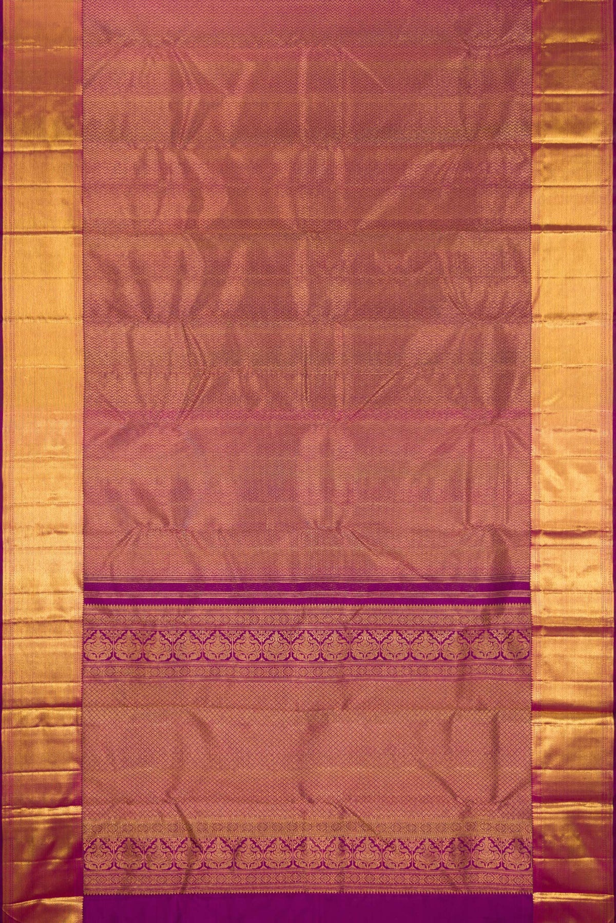 Flat view of Pure Silk Magenta Kanchipuram Saree with Zari Brocade on the body and Zari Border. 