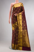 Pure Silk Brown Kanchipuram Saree with Zari Brocade on the body and Zari Border.  displayed on a mannequin