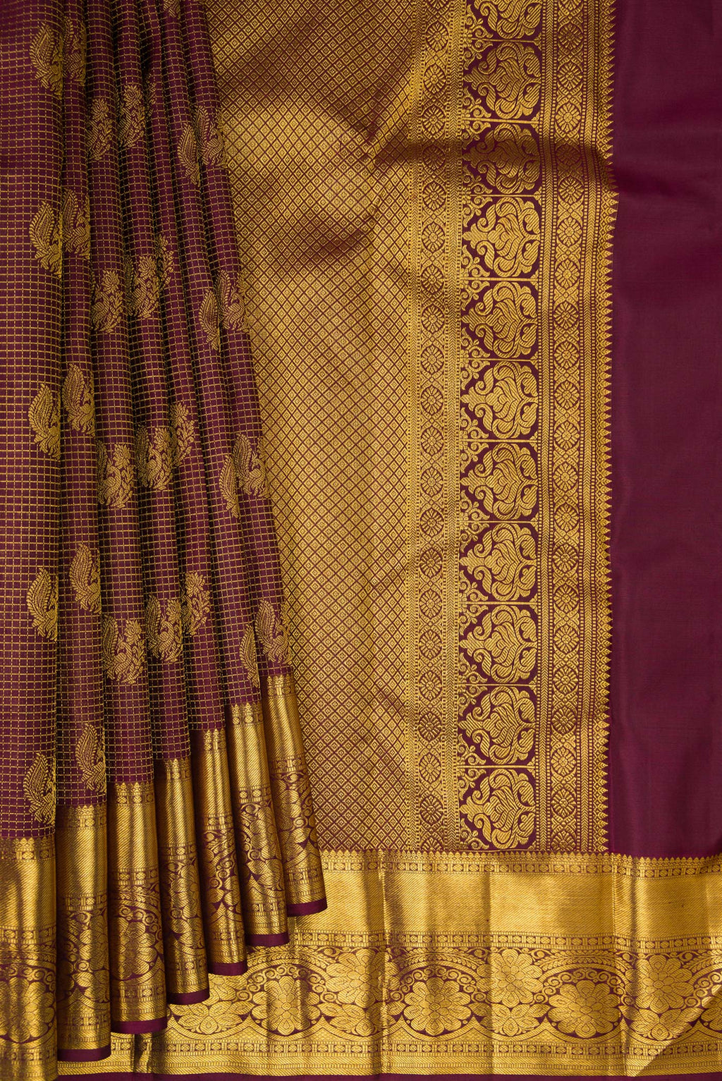 Pleats and pallu of Pure Silk Brown Kanchipuram Saree with Zari Brocade on the body and Zari Border. 