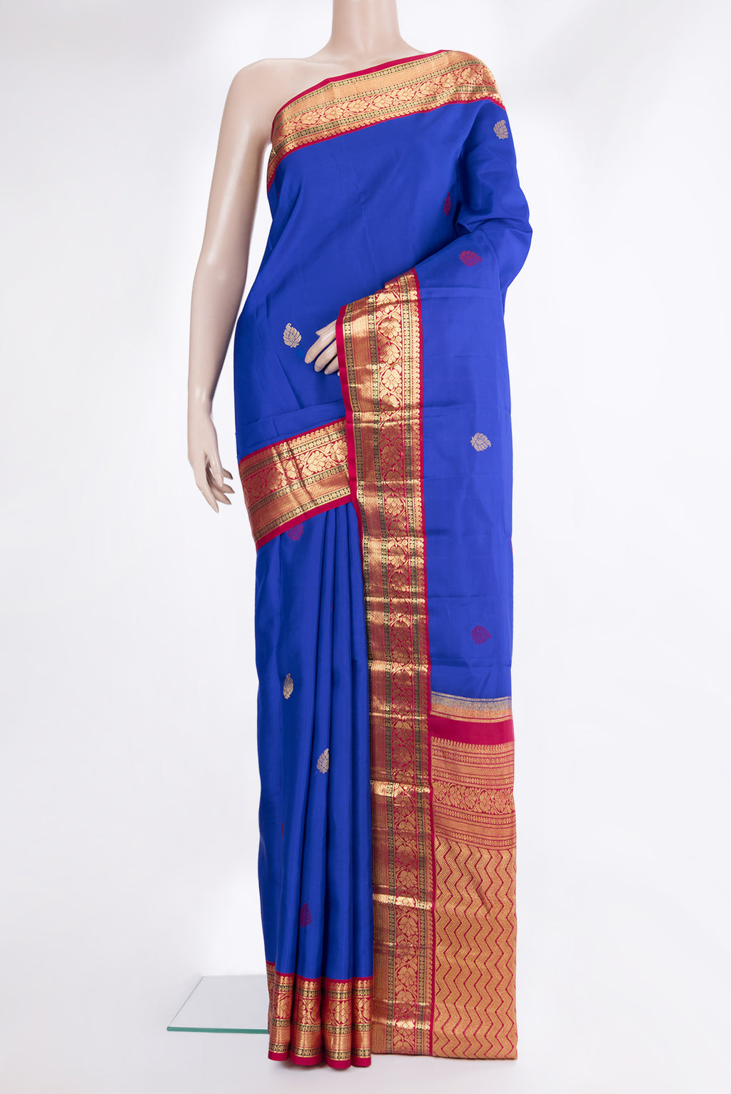 Pure Silk Royal Blue Kanjivaram Saree with Zari And Thread Butta on the body and Zari Border.  displayed on a mannequin
