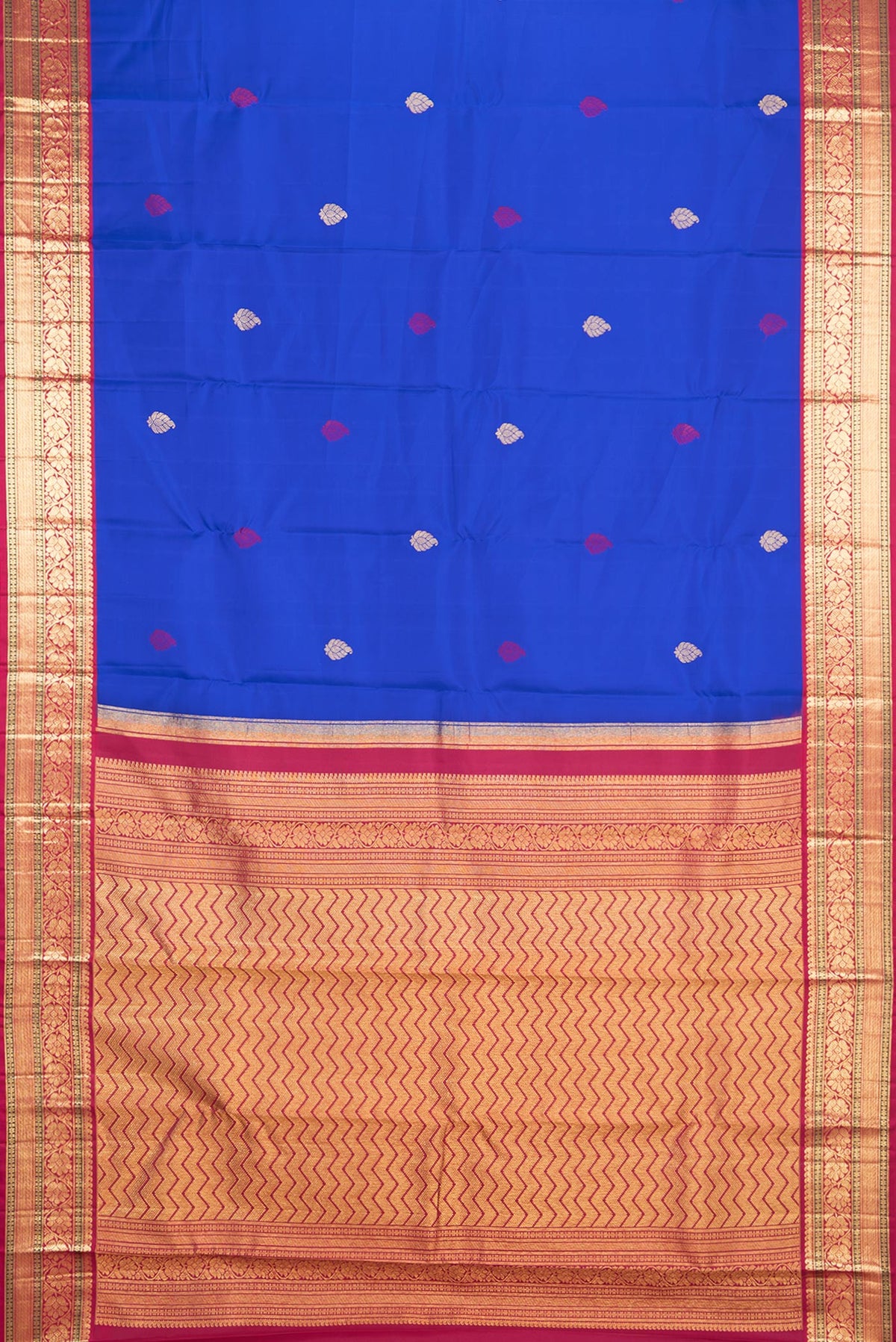 Flat view of Pure Silk Royal Blue Kanjivaram Saree with Zari And Thread Butta on the body and Zari Border. 