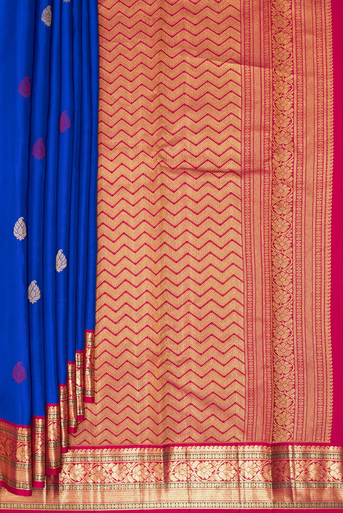 Pleats and pallu of Pure Silk Royal Blue Kanjivaram Saree with Zari And Thread Butta on the body and Zari Border. 