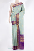 Pure Silk Sea Green Kanchipuram Saree with Zari Butta on the body and Zari Border.  displayed on a mannequin