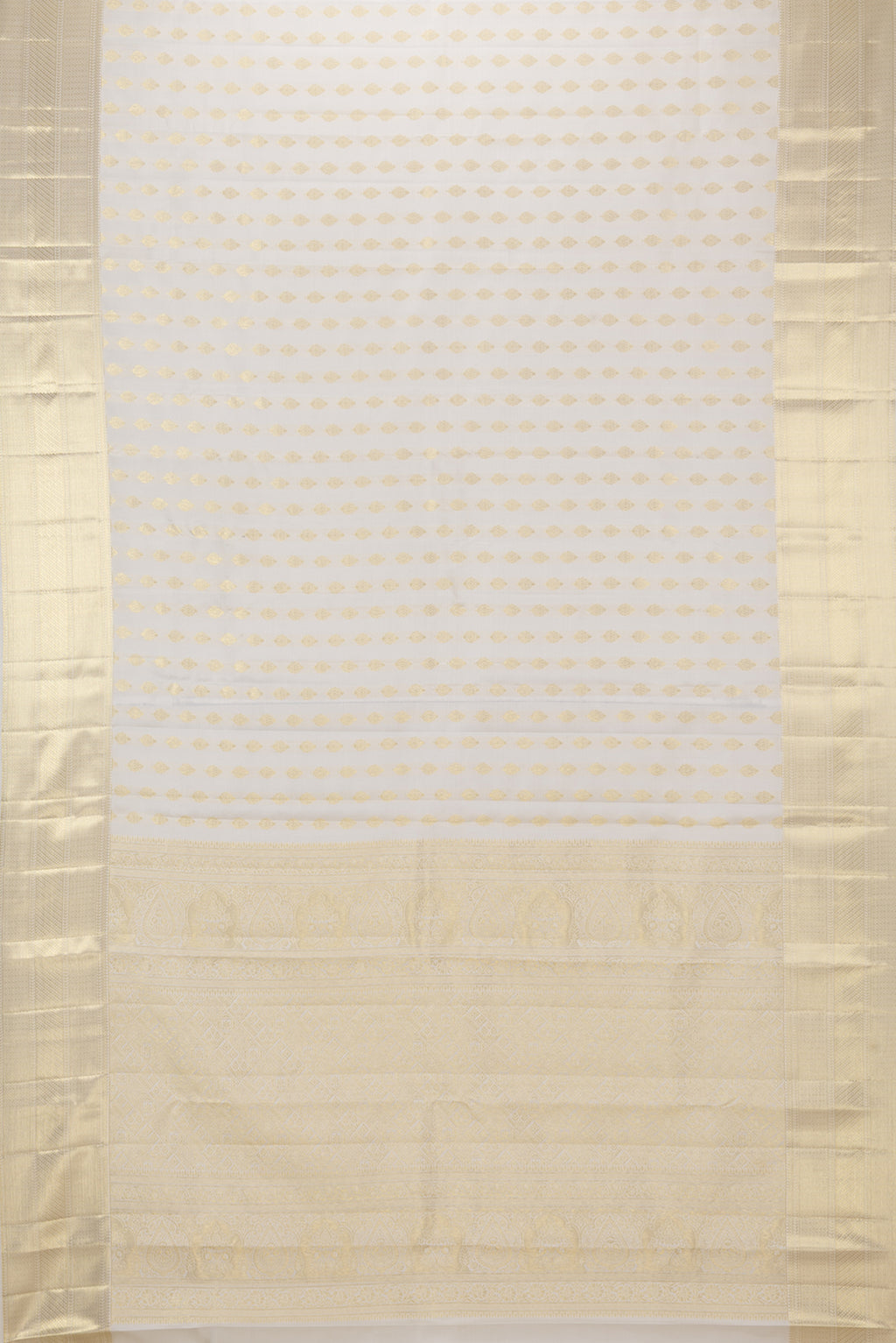 Flat view of Pure Silk White Kanchipuram Saree with Zari Butta on the body and Zari Border. 