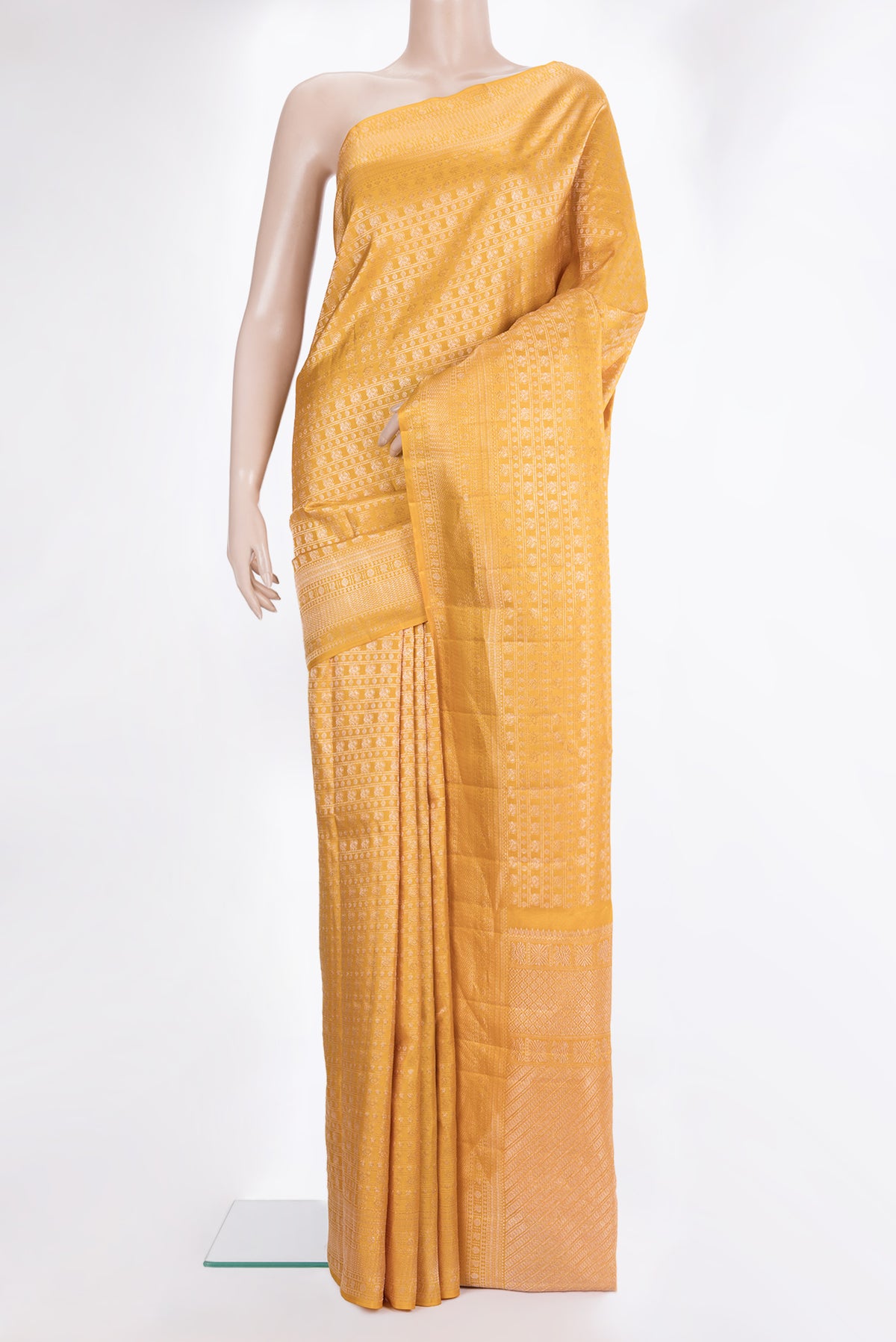 Pure Silk Mustard Dual Tone Kanchipuram Saree with Zari Brocade on the body and Zari Border.  displayed on a mannequin