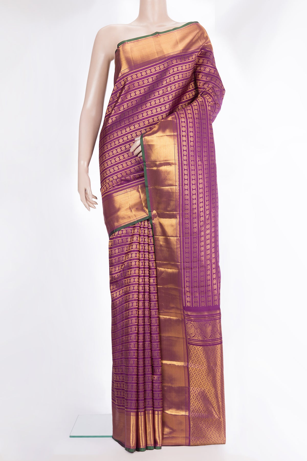 Pure Silk Magenta Kanchipuram Saree with Zari Butta on the body and Zari Border.  displayed on a mannequin