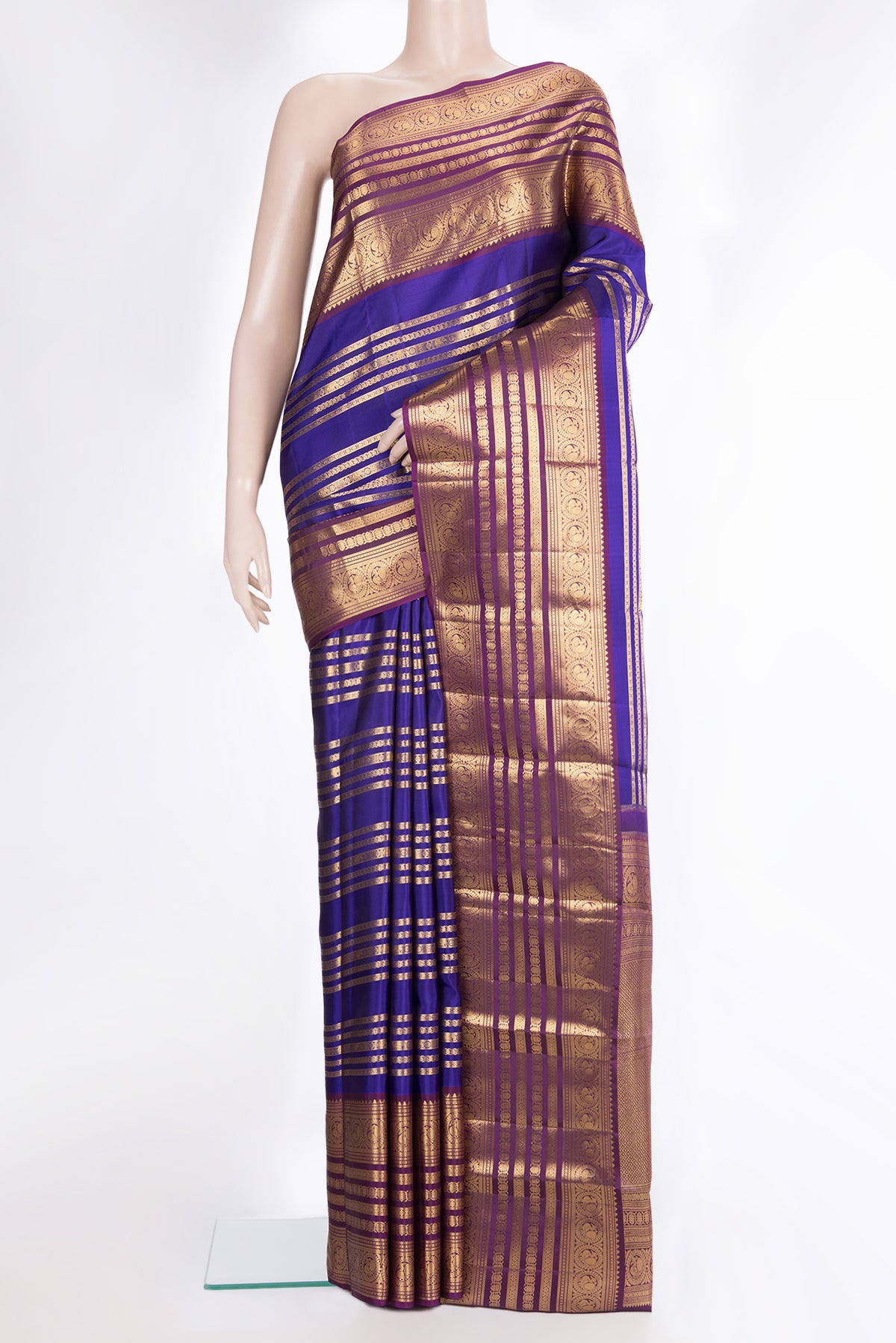 Pure Silk Royal Blue Kanjivaram Saree with Stripes on the body and Fancy Border.  displayed on a mannequin