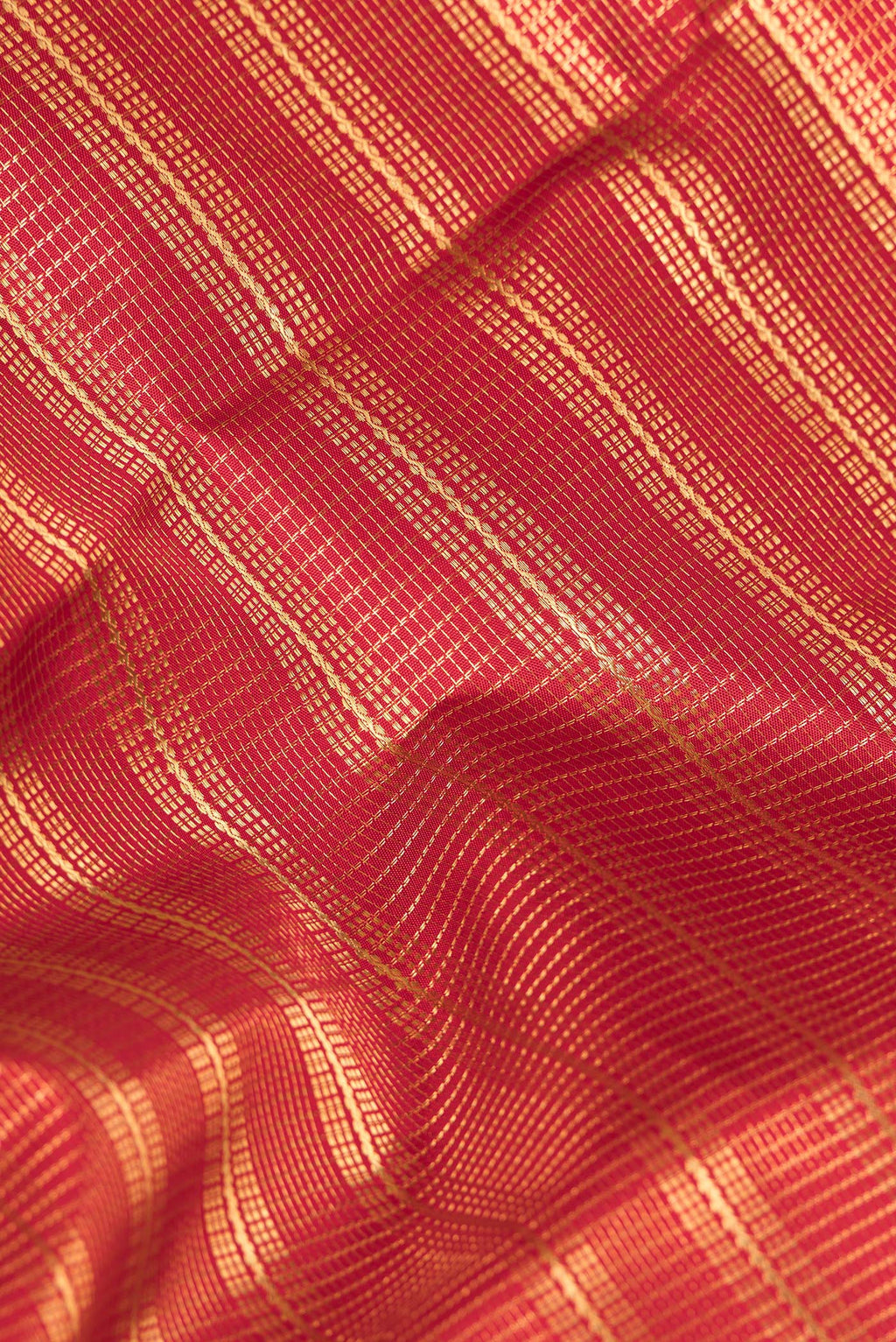 Close up of Pure Silk Red Kanjivaram Saree with Zari Brocade on the body and Fancy Border.  displaying folds