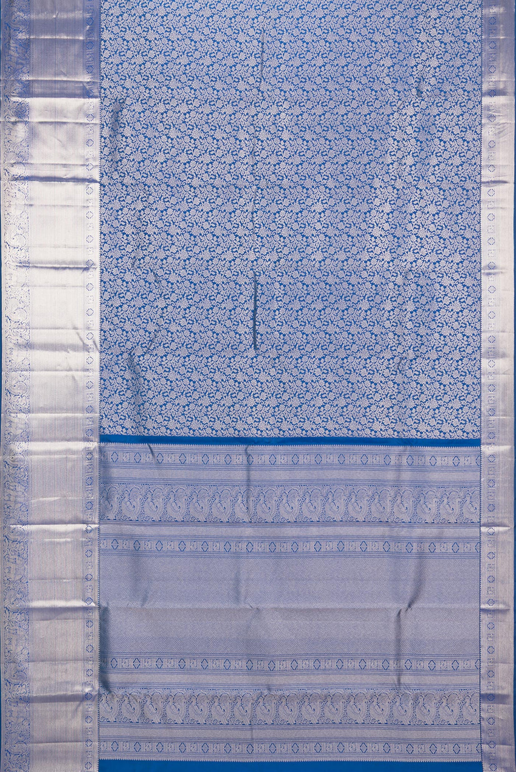 Flat view of Pure Silk Peacock Blue Dual Tone Kanchipuram Saree with Zari Brocade on the body and Zari Border. 
