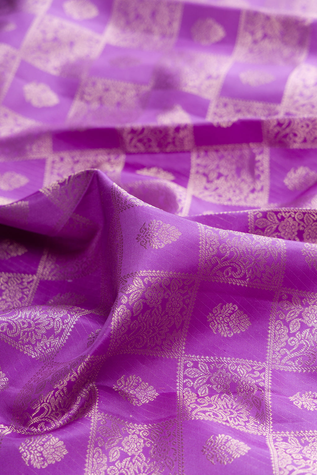 Close up of Pure Silk Lavender Kanchipuram Saree with Zari Brocade on the body and Zari Border.  displaying folds