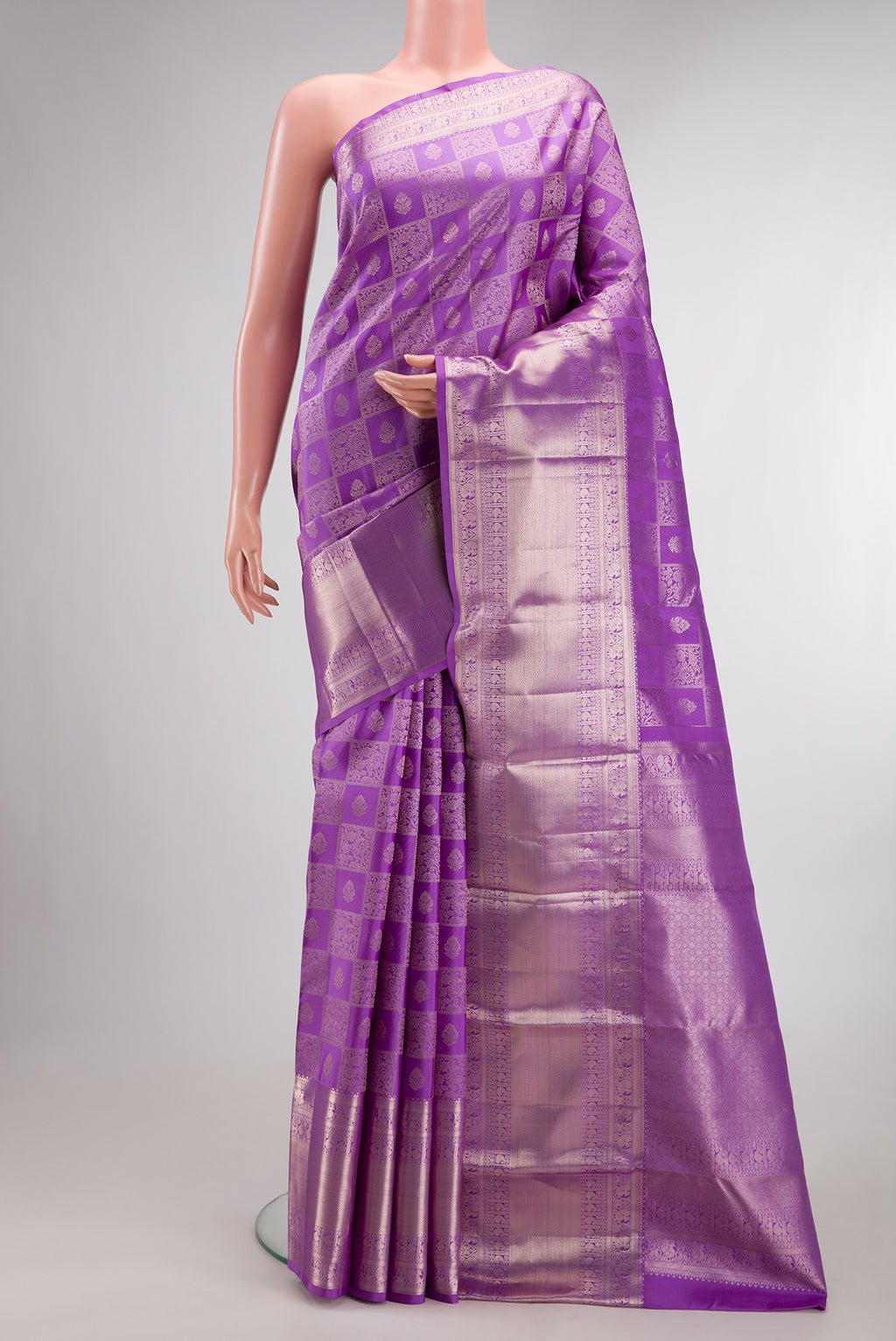 Pure Silk Lavender Kanchipuram Saree with Zari Brocade on the body and Zari Border.  displayed on a mannequin