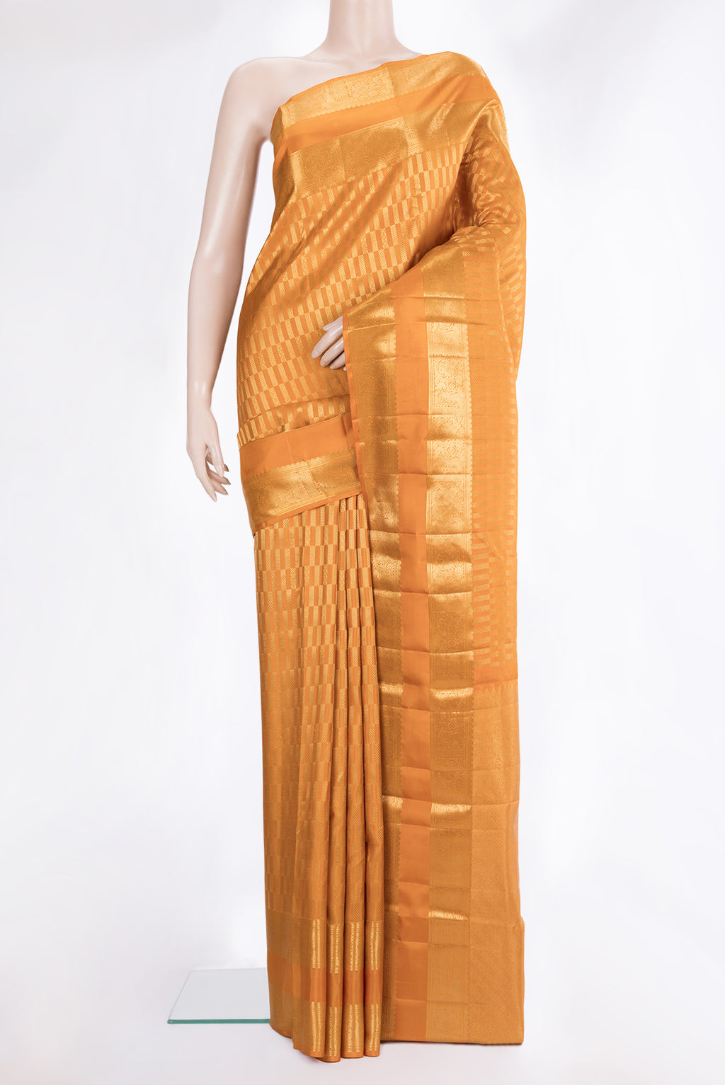 Pure Silk Mustard Kanjivaram Saree with Zari Brocade on the body and Zari Border.  displayed on a mannequin