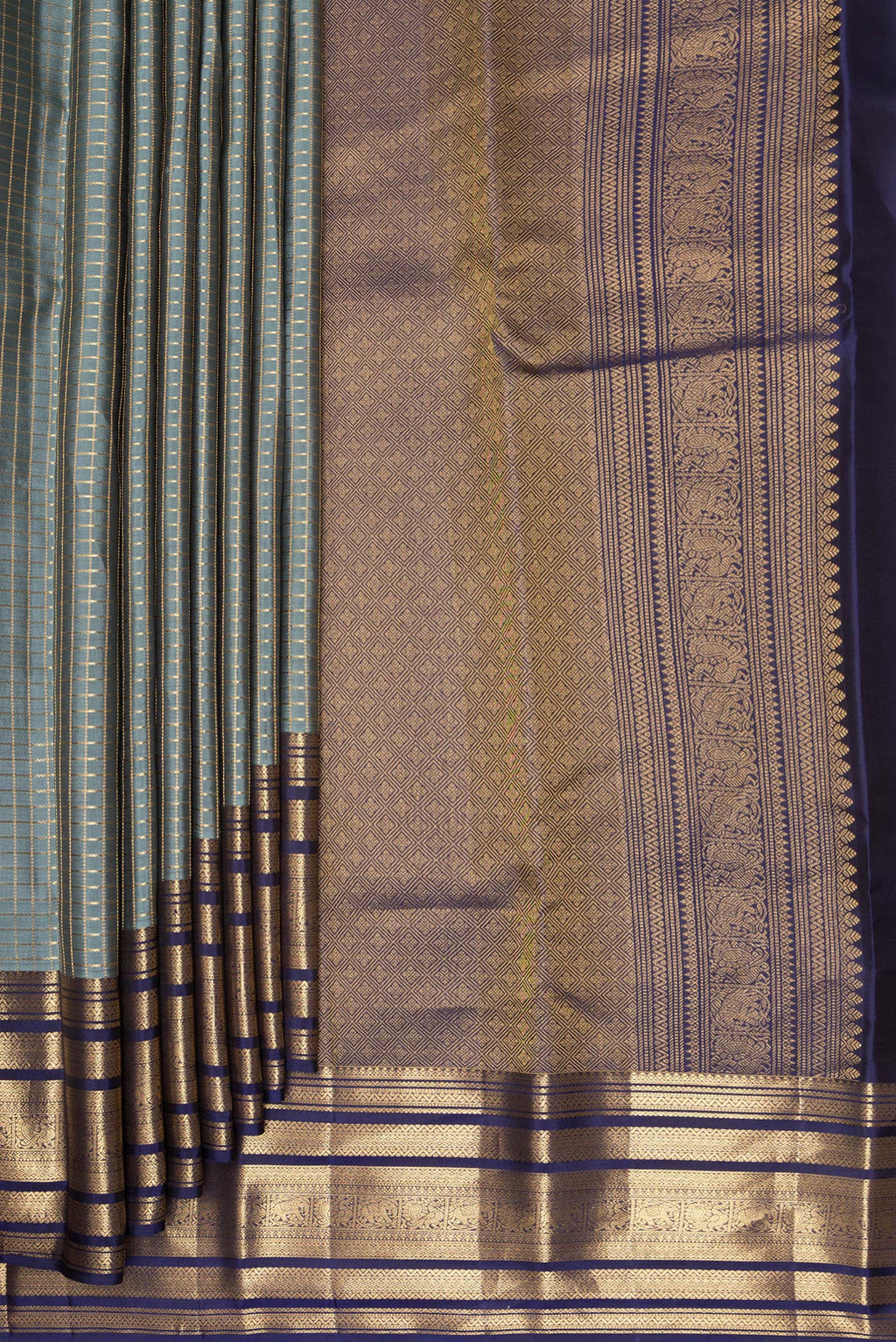Pleats and pallu of Pure Silk Grey Kanjivaram Saree with Checked design on the body and Zari Border. 