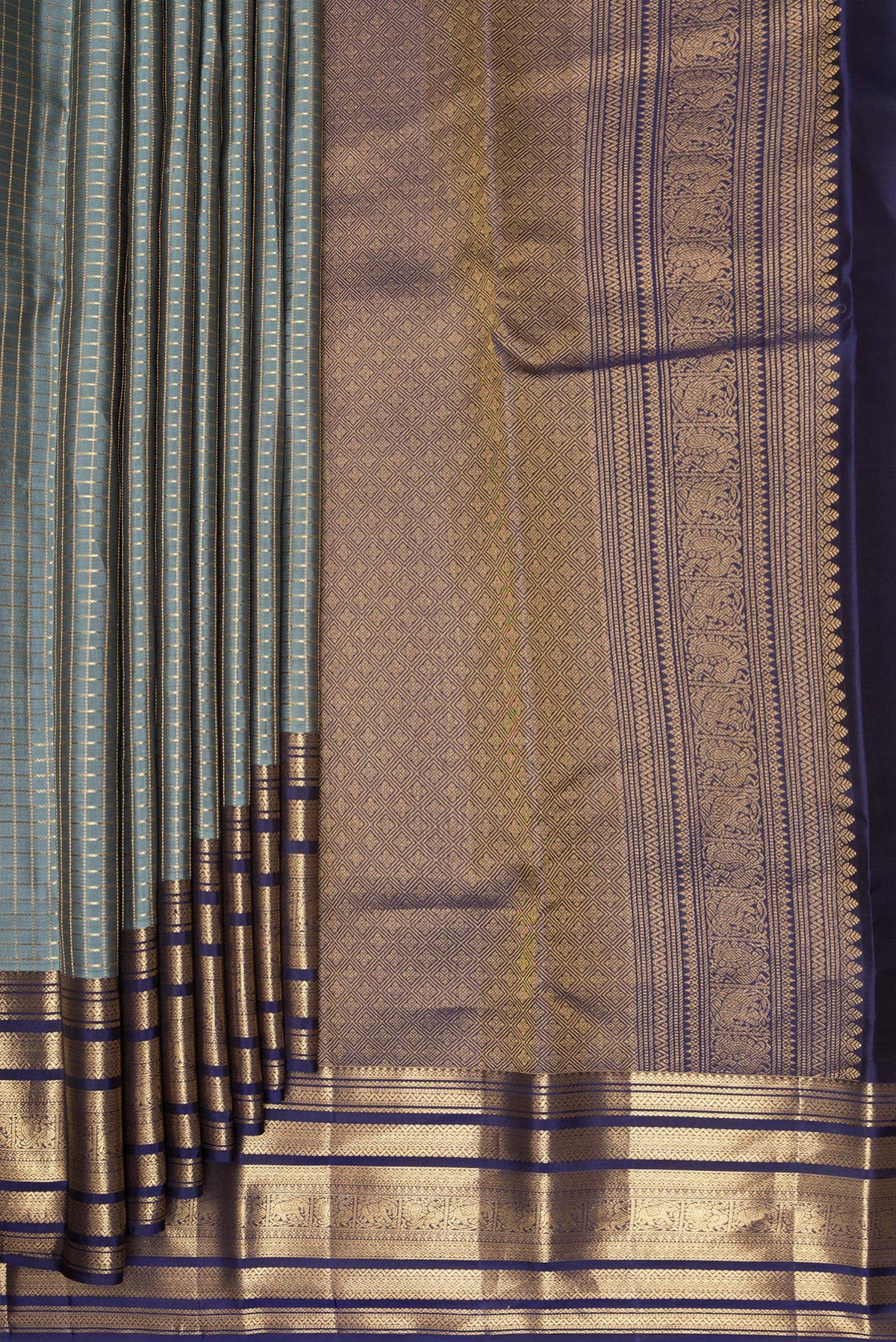 Pleats and pallu of Pure Silk Grey Kanjivaram Saree with Checked design on the body and Zari Border. 