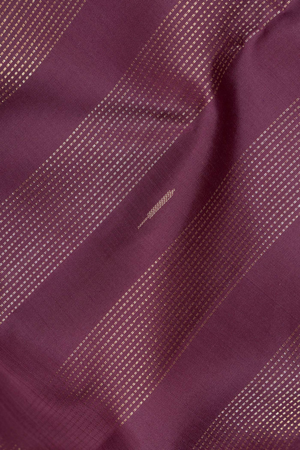 Close up of Pure Silk Burgundy Kanjivaram Saree with Stripes on the body and Fancy Border.  displaying folds