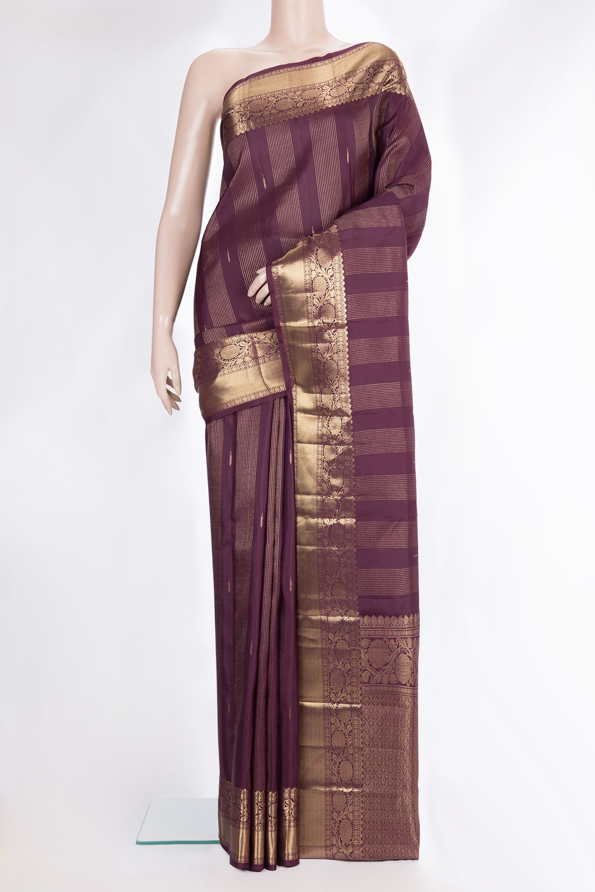 Pure Silk Burgundy Kanjivaram Saree with Stripes on the body and Fancy Border.  displayed on a mannequin