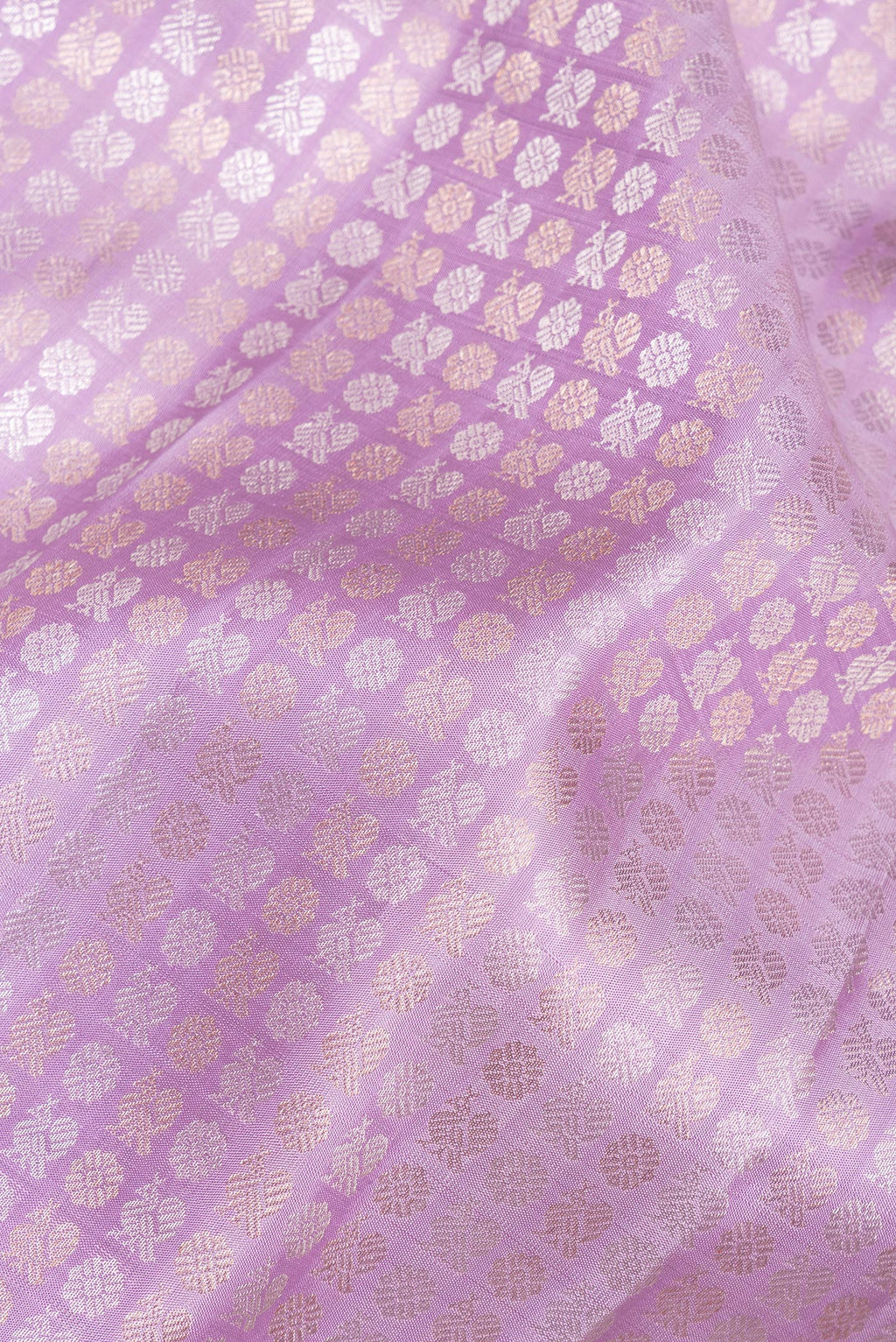 Close up of Pure Silk Lavender Kanchipuram Saree with Zari Brocade on the body and Zari Border.  displaying folds