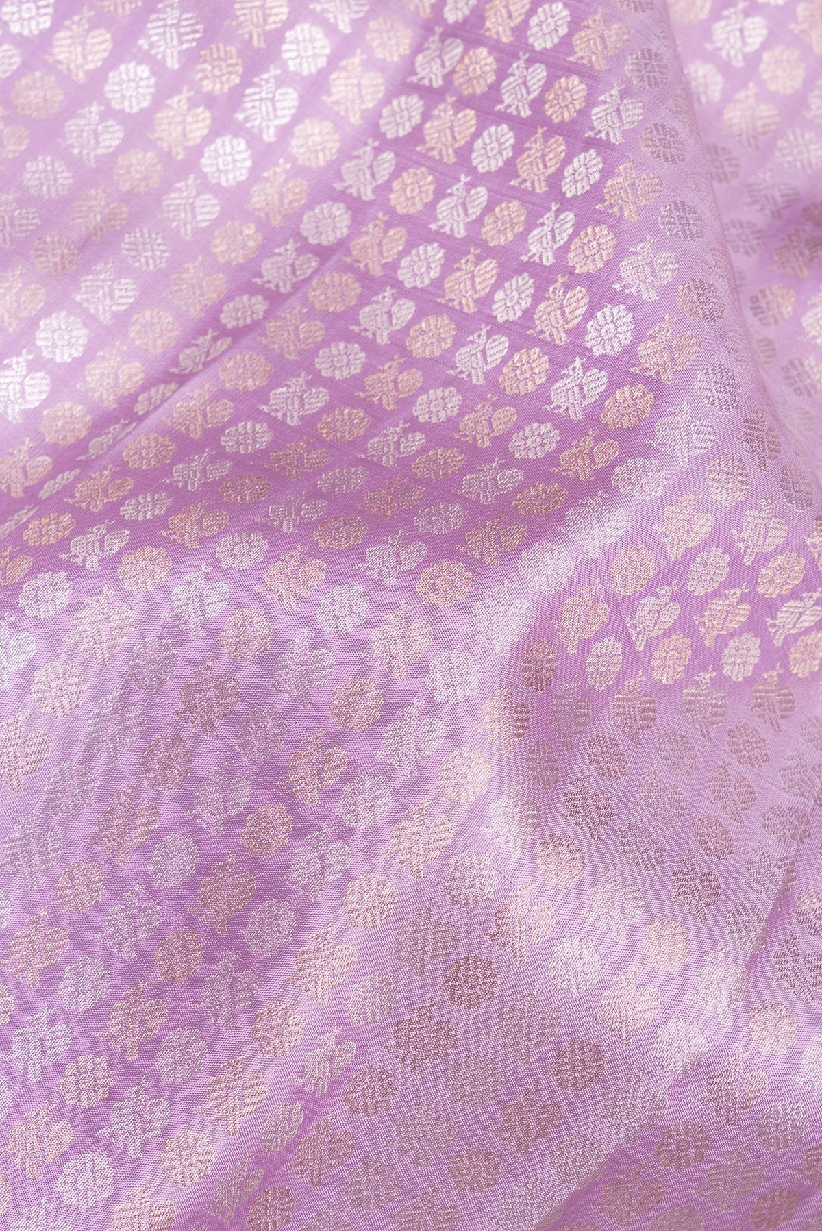 Close up of Pure Silk Lavender Kanchipuram Saree with Zari Brocade on the body and Zari Border.  displaying folds
