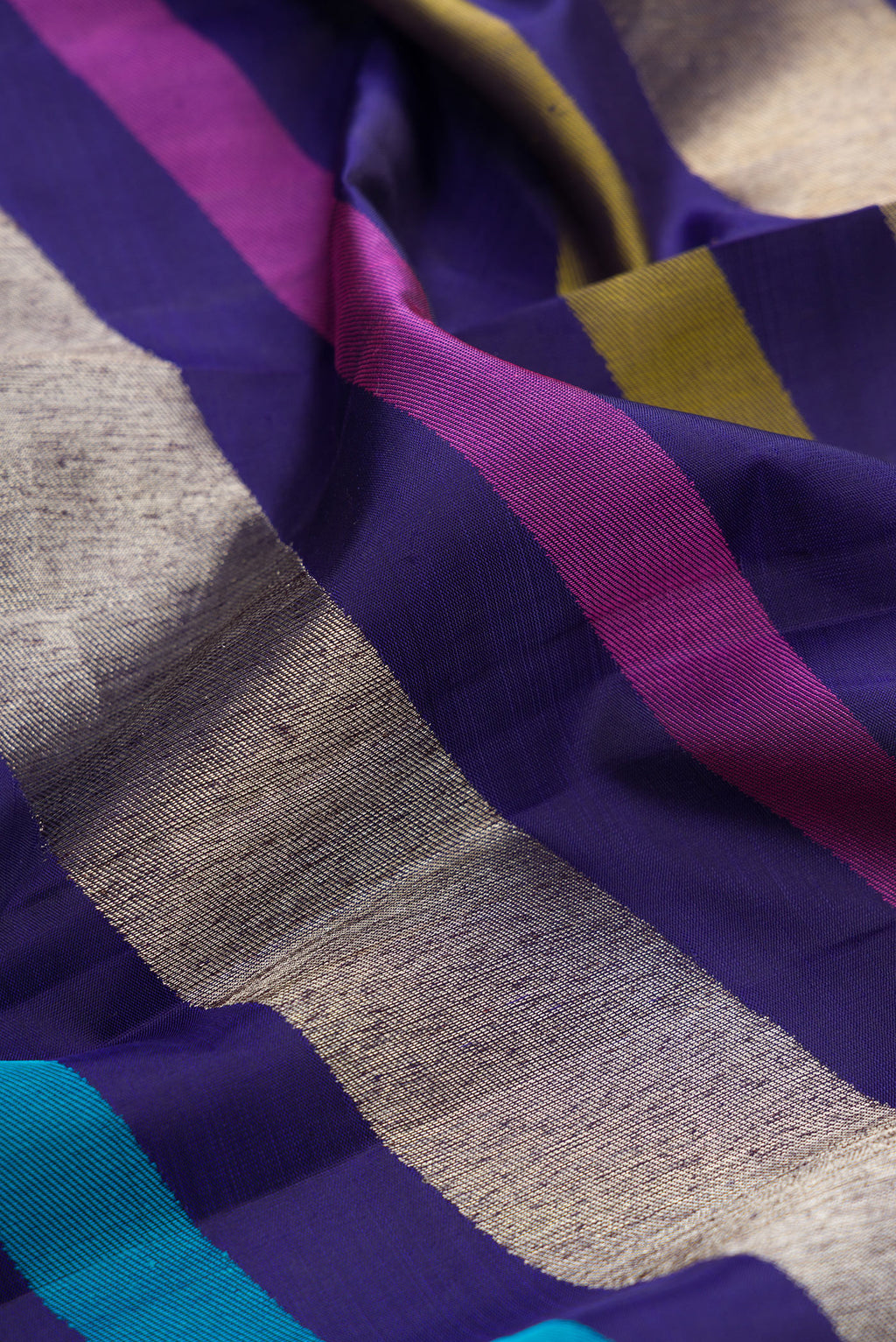 Close up of Pure Silk Navy Blue Dual Tone Kanchipuram Saree with Stripes on the body and Without Border.  displaying folds