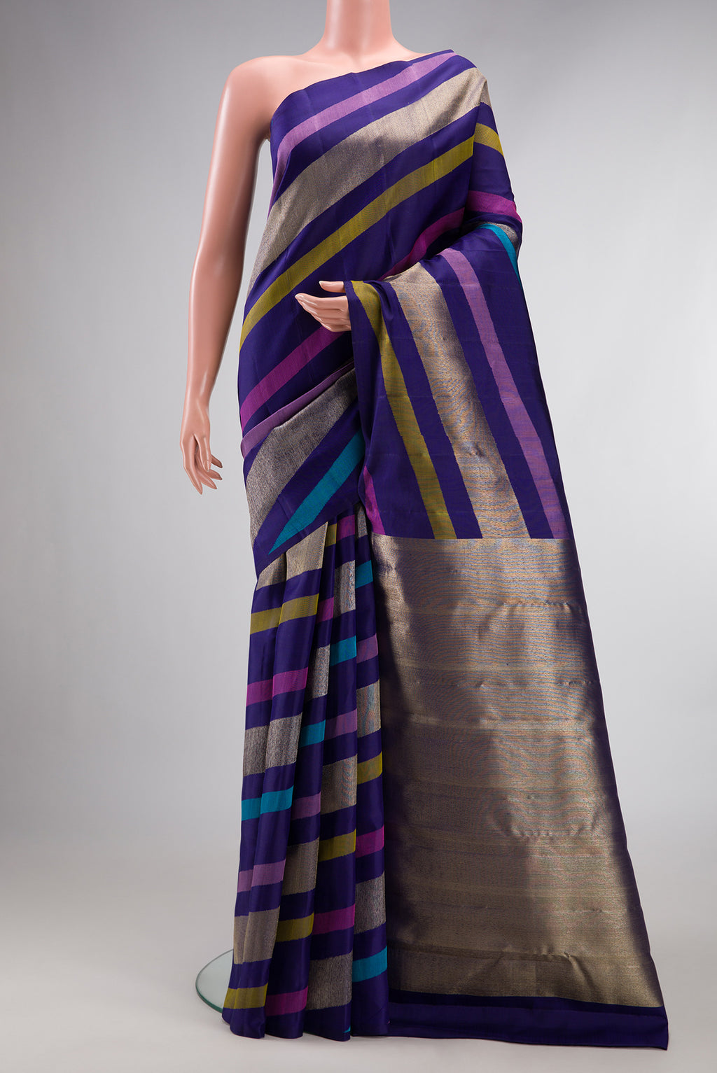 Pure Silk Navy Blue Dual Tone Kanchipuram Saree with Stripes on the body and Without Border.  displayed on a mannequin