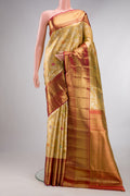 Gold Dual Tone Kanjivaram Tissue Saree with Zari Brocade on the body and Zari Border.  displayed on a mannequin
