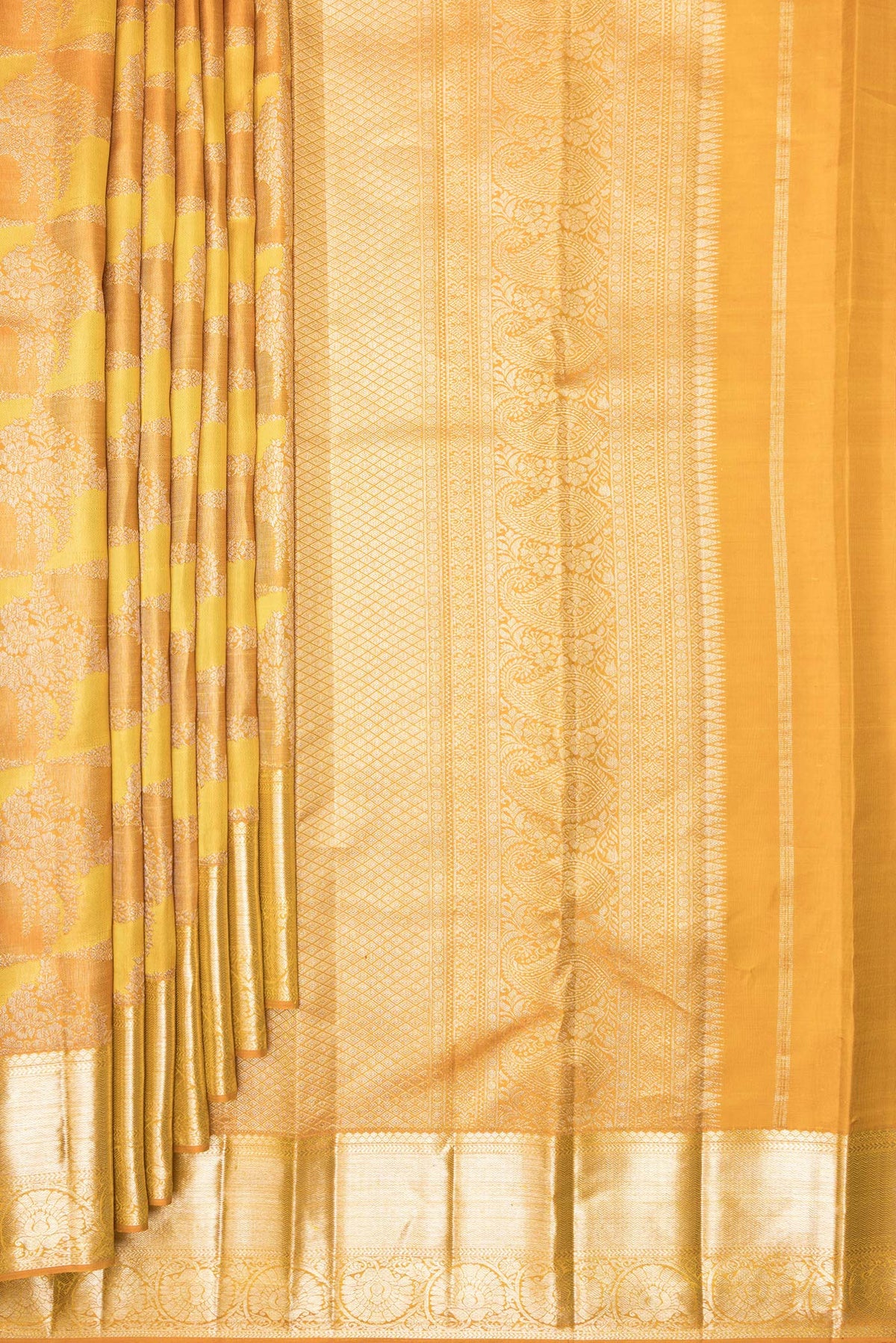 Pleats and pallu of Pure Silk Mustard Dual Tone Kanjivaram Saree with Zari Brocade on the body and Zari Border. 