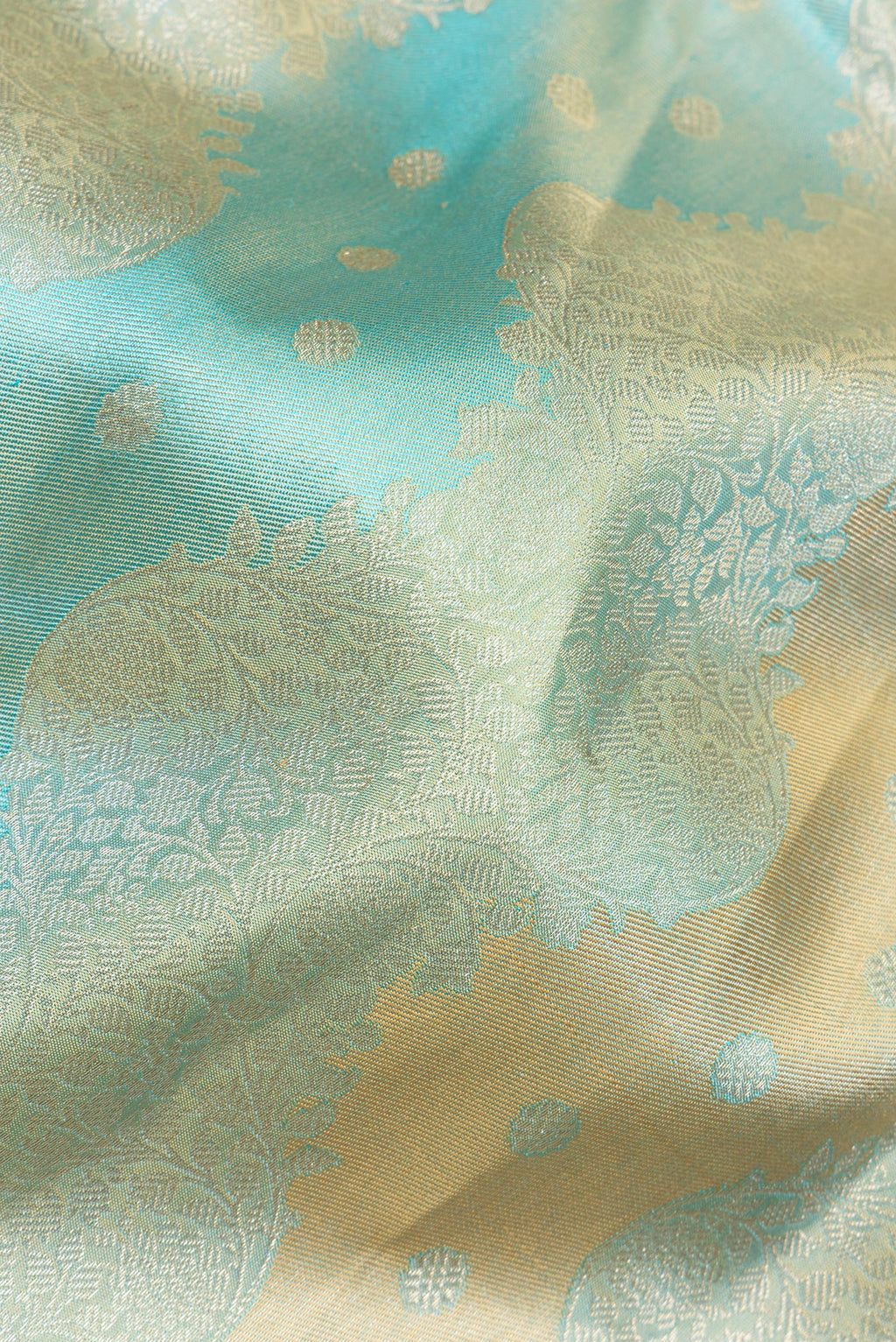Close up of Pure Silk Sky Blue and Gold Color Kanjivaram Saree with Zari Brocade on the body and Zari Border.  displaying folds