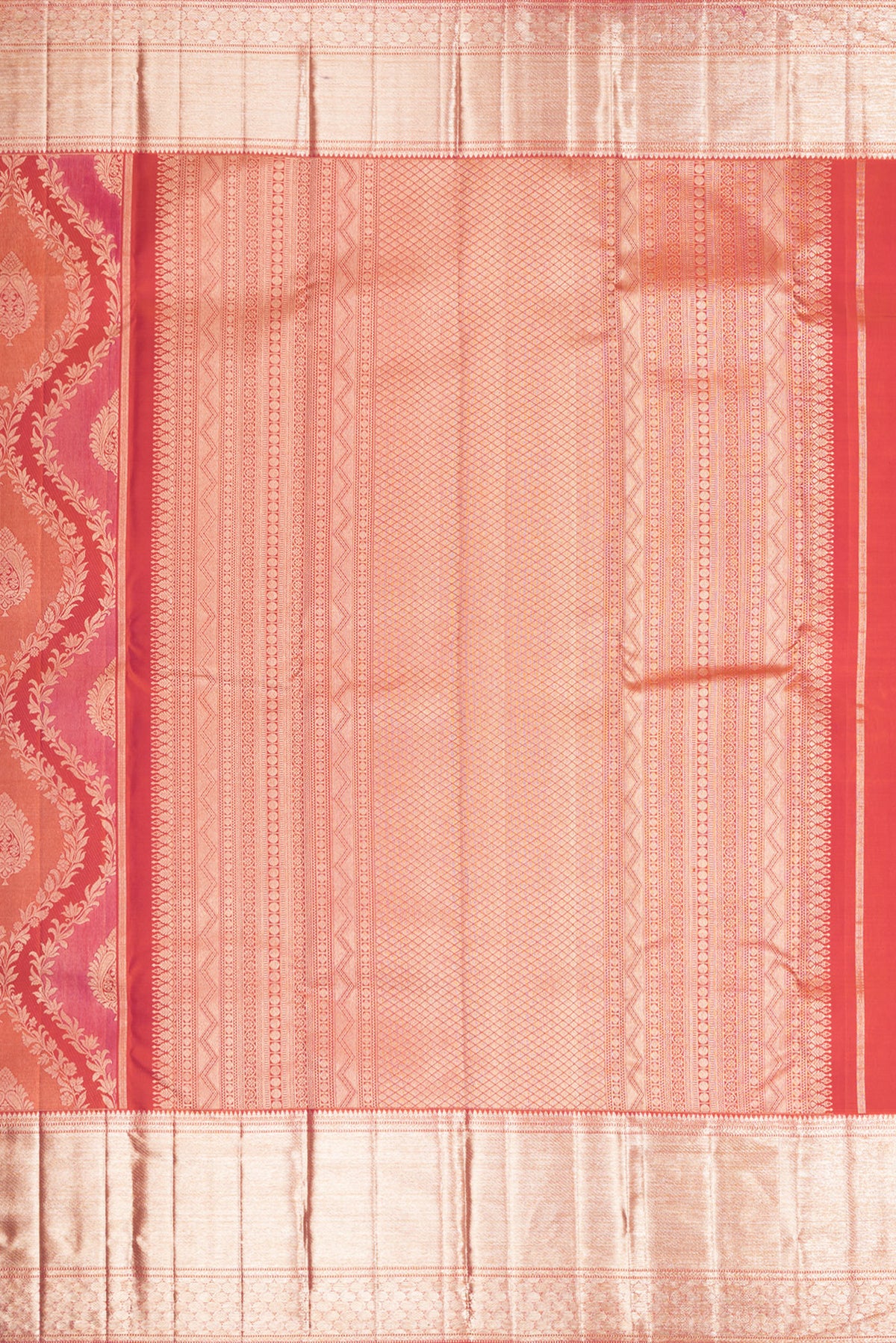 Close up image of the pallu of Pure Silk Orange Dual Tone Kanjivaram Saree with Zari Brocade on the body and Zari Border. 