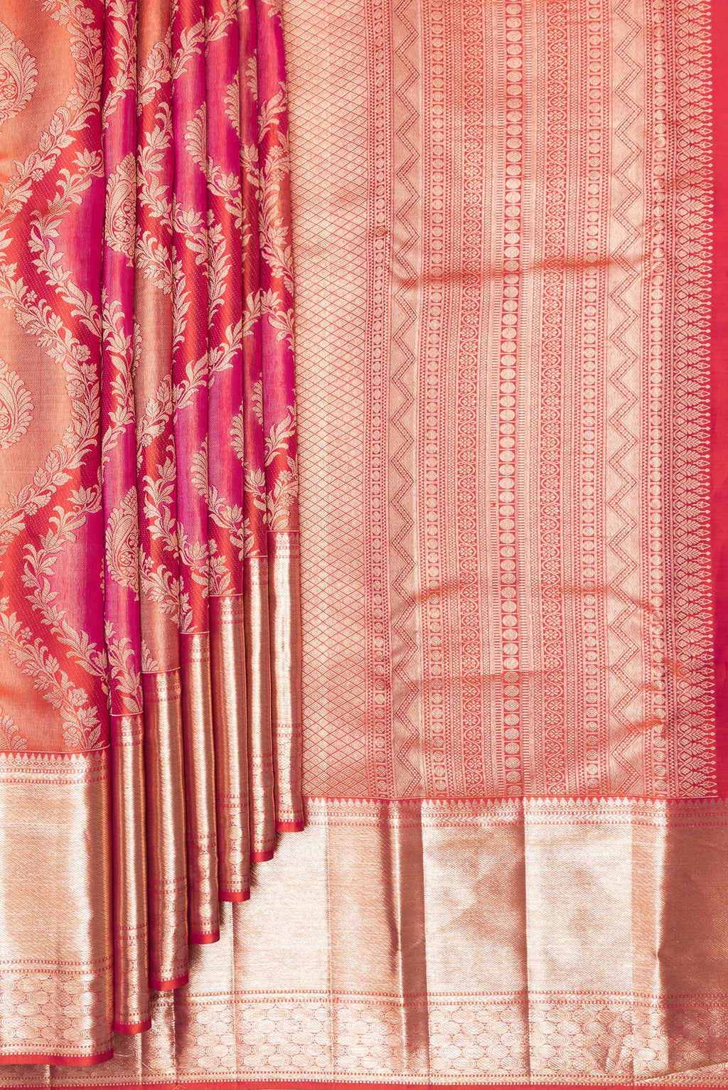 Pleats and pallu of Pure Silk Orange Dual Tone Kanjivaram Saree with Zari Brocade on the body and Zari Border. 