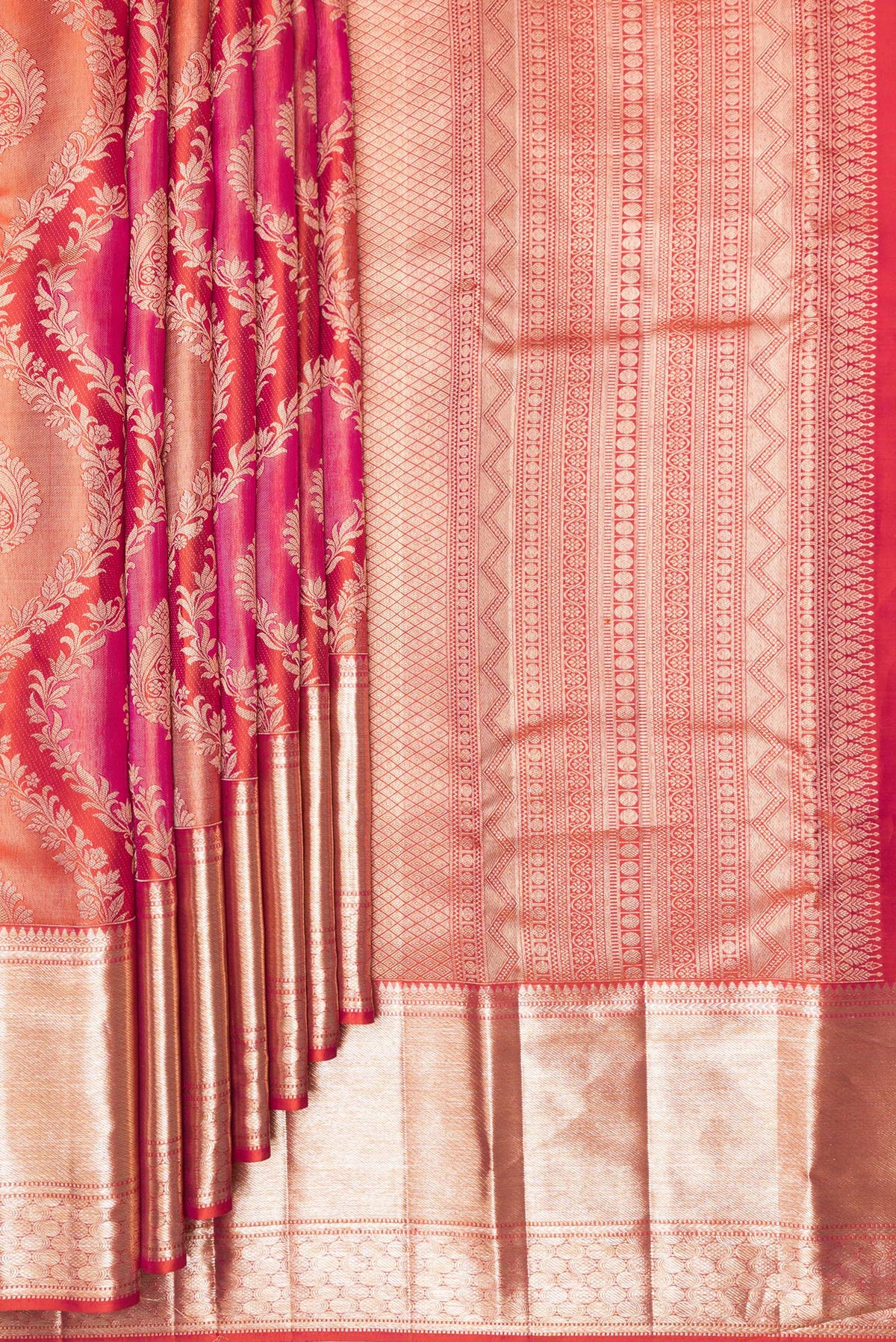 Pleats and pallu of Pure Silk Orange Dual Tone Kanjivaram Saree with Zari Brocade on the body and Zari Border. 