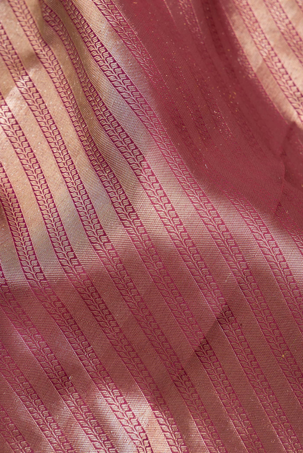 Close up of Pure Silk Maroon Kanjivaram Saree with Zari Brocade on the body and Fancy Border.  displaying folds