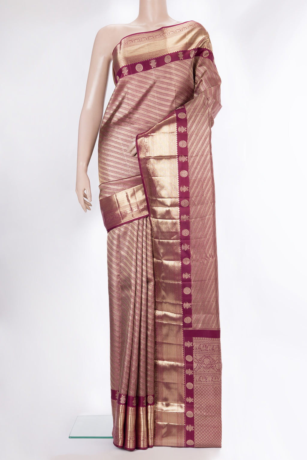 Pure Silk Maroon Kanjivaram Saree with Zari Brocade on the body and Fancy Border.  displayed on a mannequin
